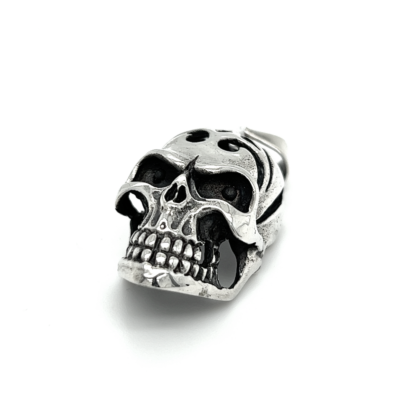 
                  
                    A distinctive Super Silver Skull Pendant with Swirl Design and an oxidized finish on a white background.
                  
                
