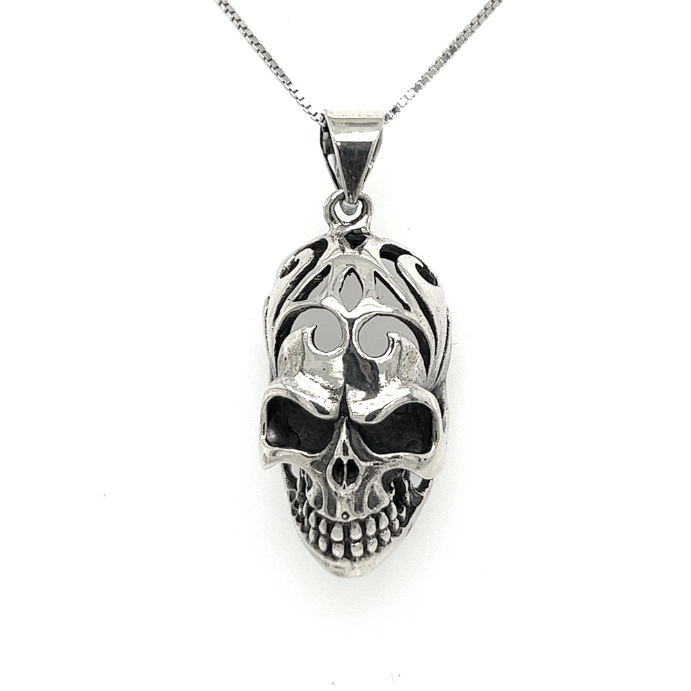 
                  
                    A Super Silver Skull Pendant with Swirl Design on a chain.
                  
                