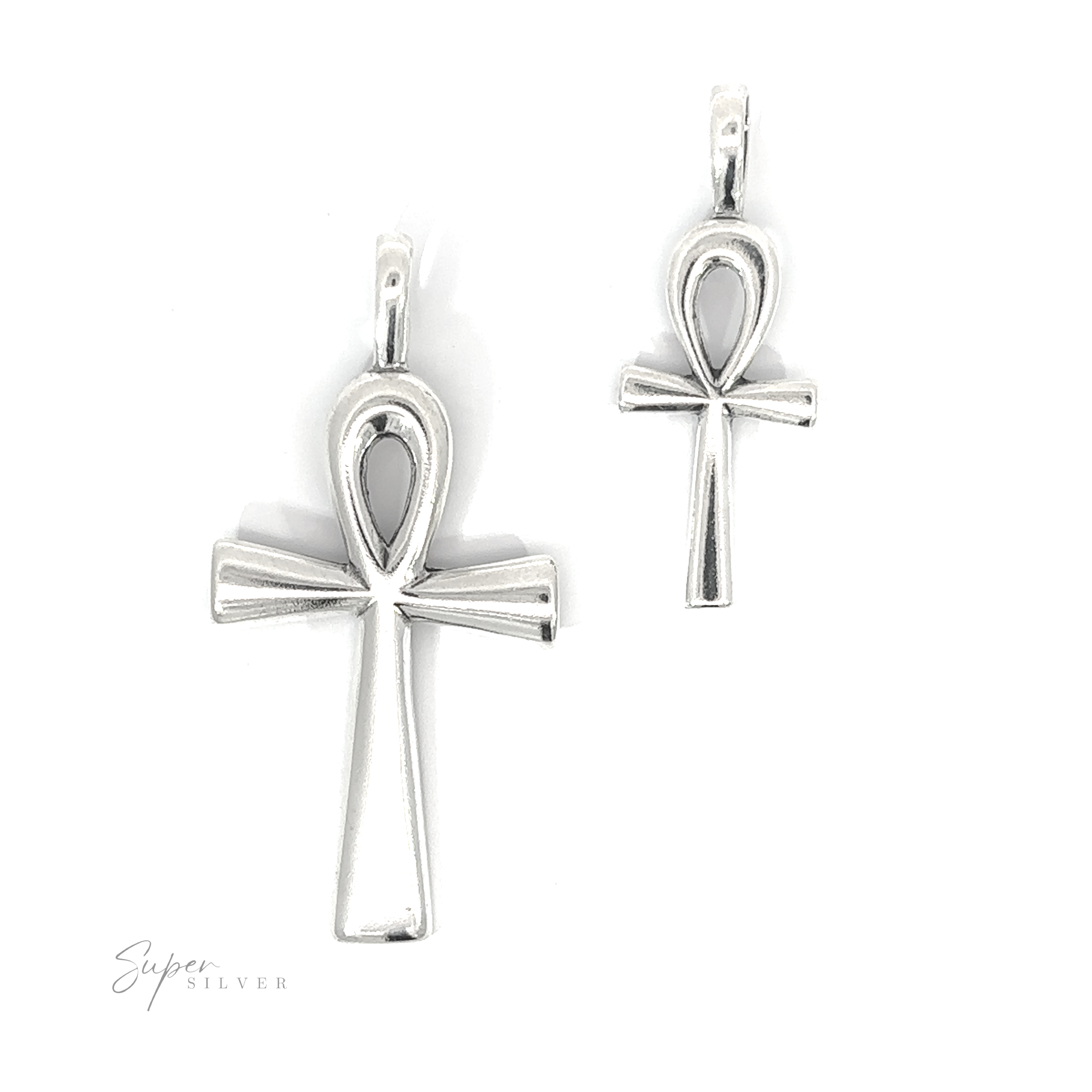 Two Ankh Pendants of different sizes placed side by side on a white background. The larger is on the left, and the smaller on the right, with the text "Super Silver" in the lower left corner. These ancient Egyptian symbols represent eternal life.