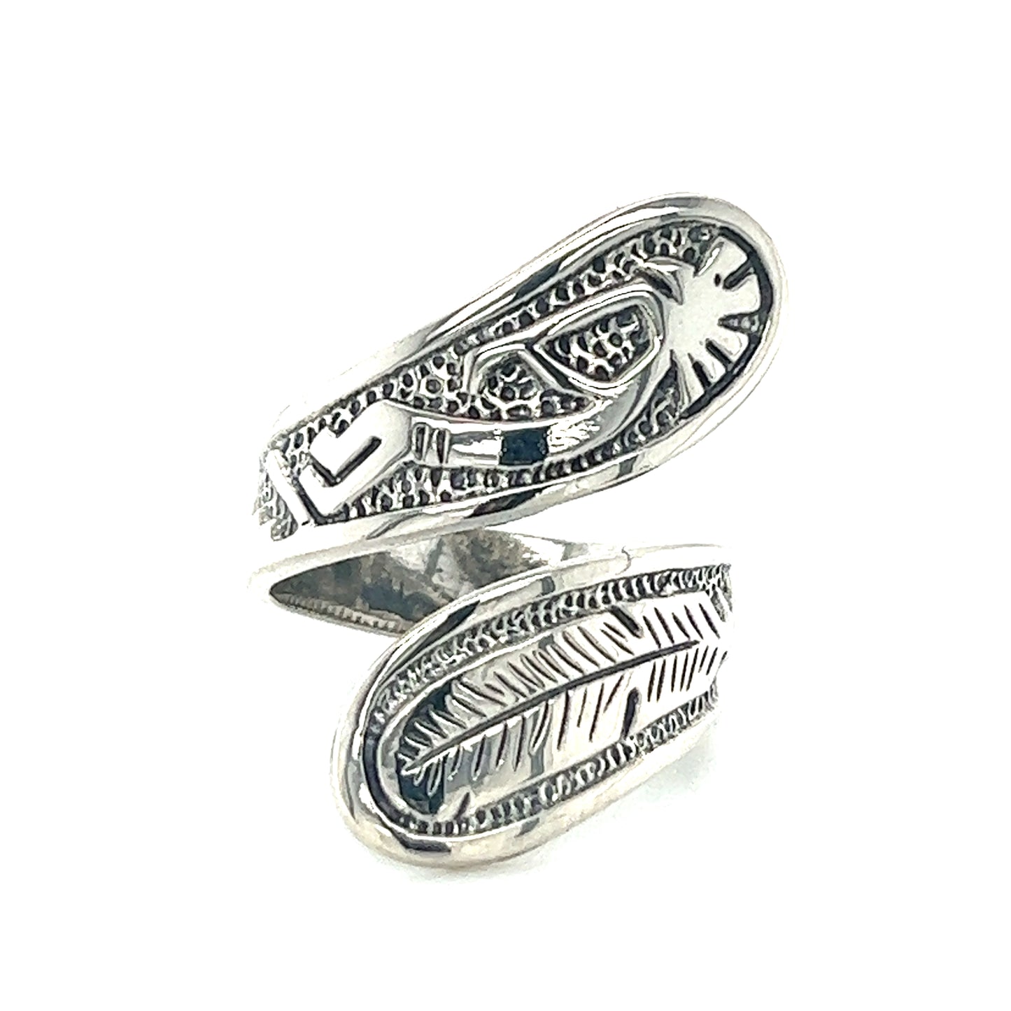 A Southwest-inspired Super Silver Kokopelli and Feather Wrap Ring with intricate Kokopelli and feather designs. This unique and eye-catching adjustable ring showcases the rich artistic traditions of the region.