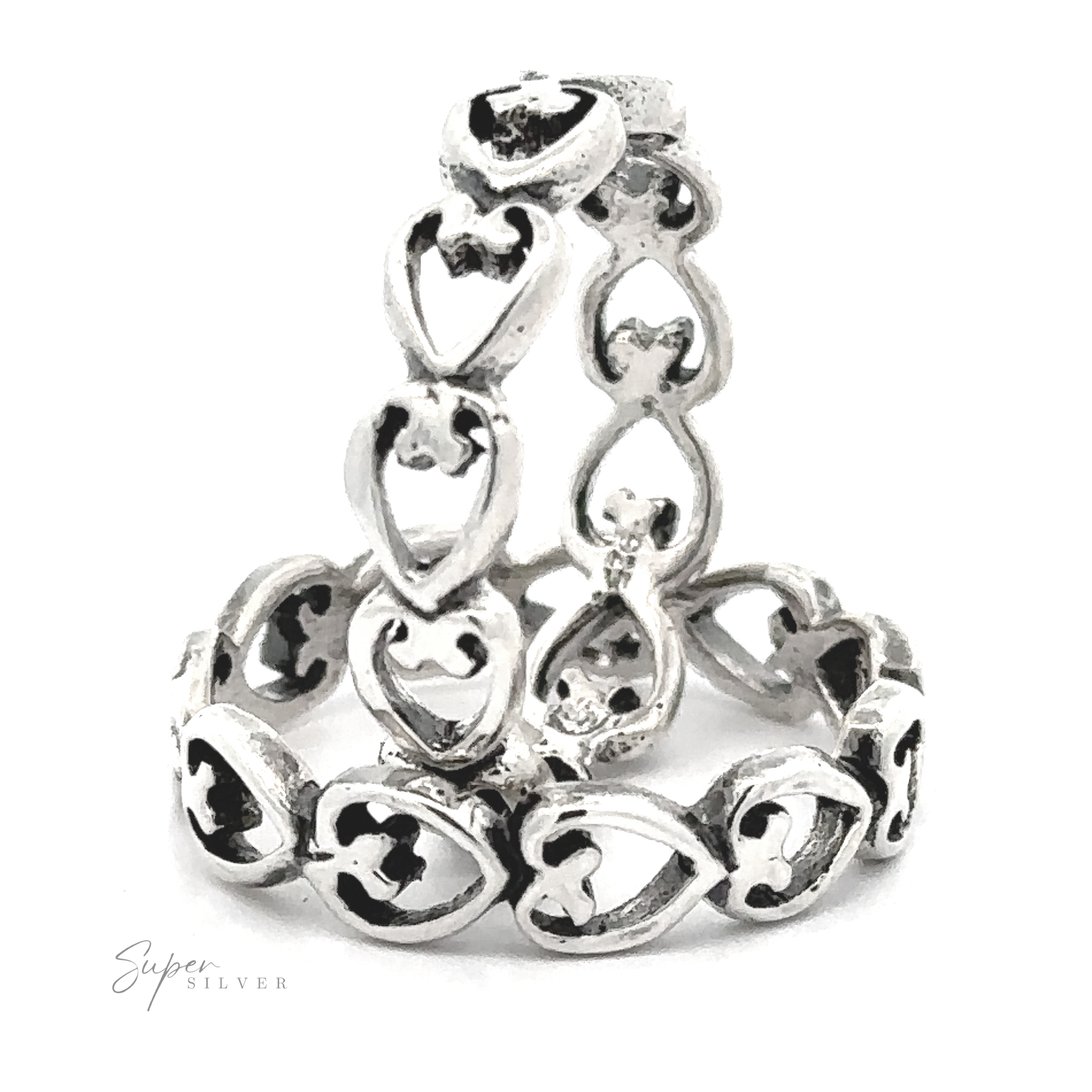 Horizontal Hearts Band featuring a sterling silver hearts band, displayed against a white background with a signature at the bottom.