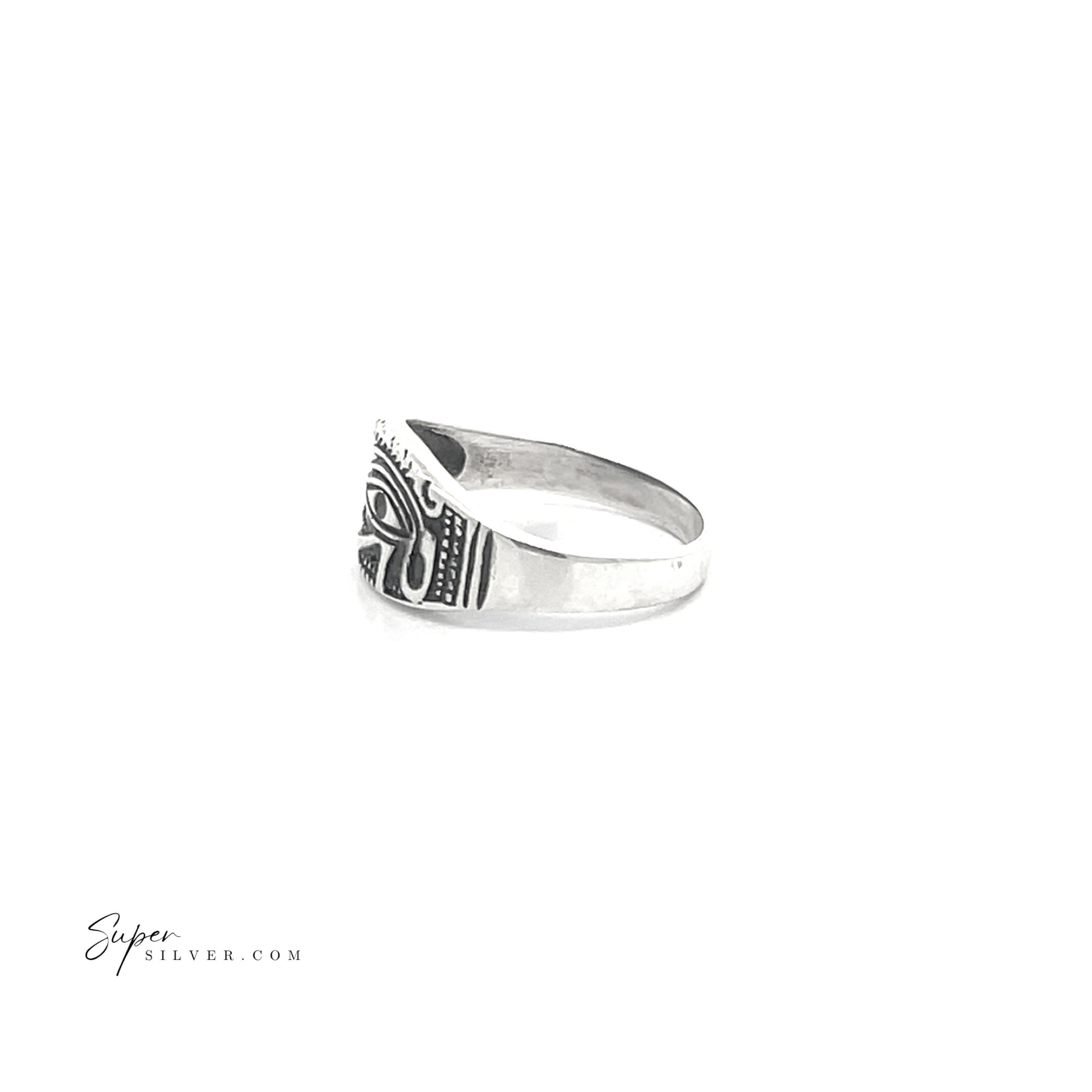The side profile of the Eye of Ra Ring, crafted from sterling silver, features an intricate engraved pattern with an oxidized finish, beautifully set against a white backdrop.