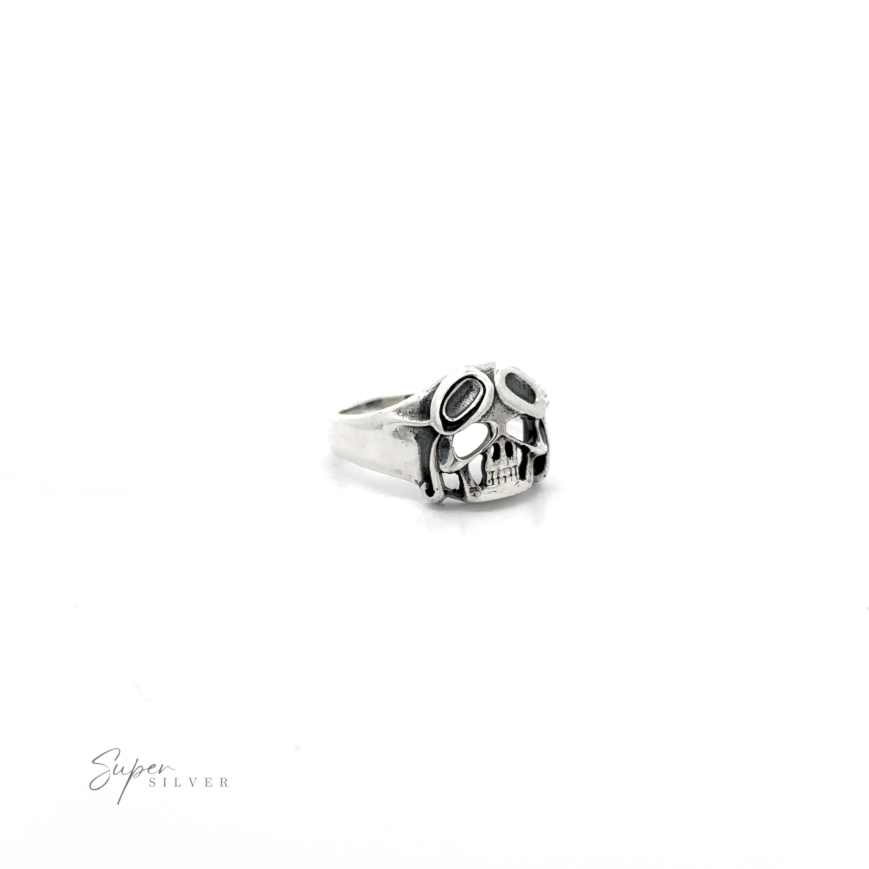A Aviator Silver Skull Ring with black detailing, isolated on a white background.