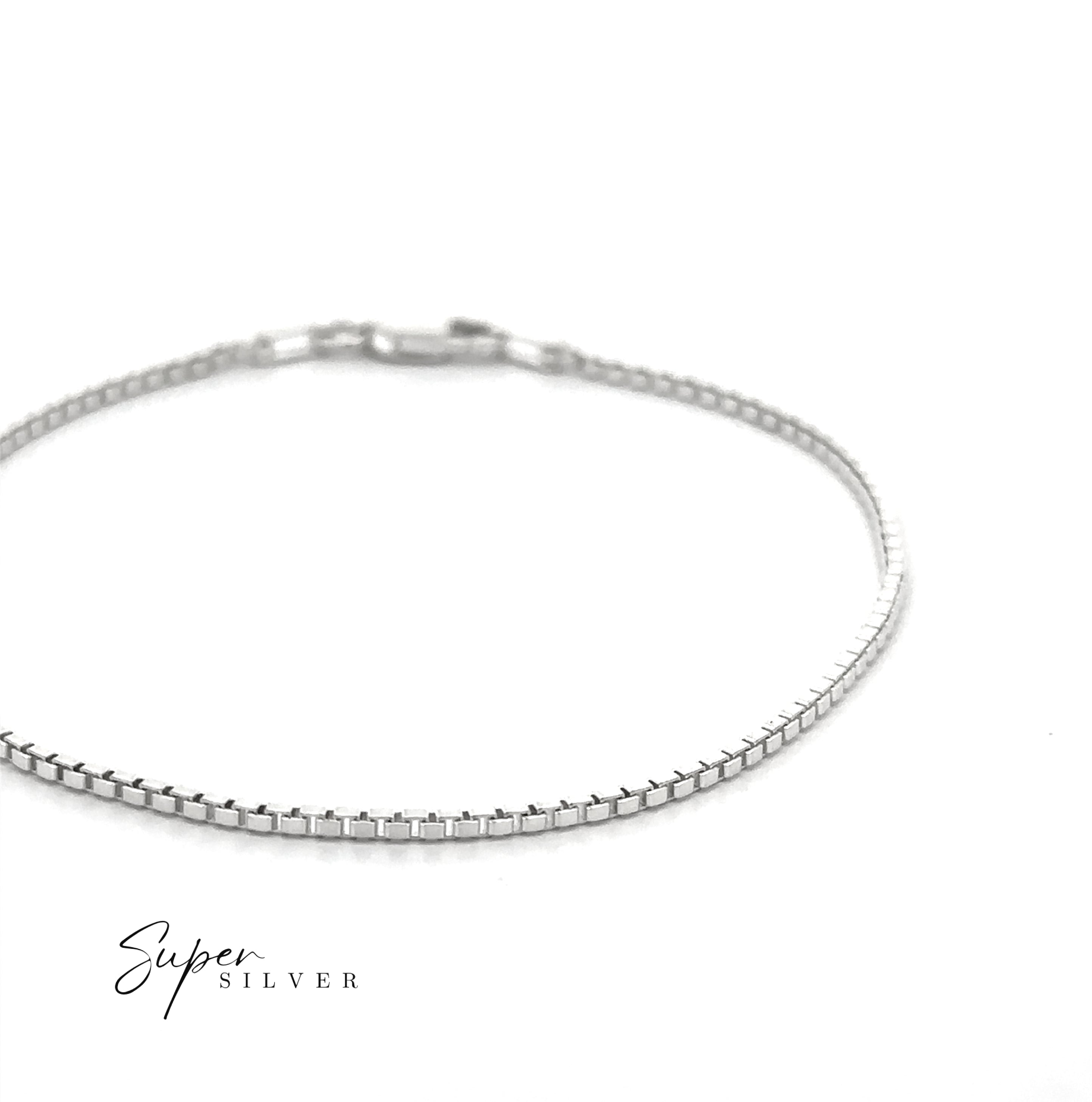 An Italian Edge Box Chain bracelet, thin and silver, is showcased on a white background with the "Super Silver" logo in the lower left corner.