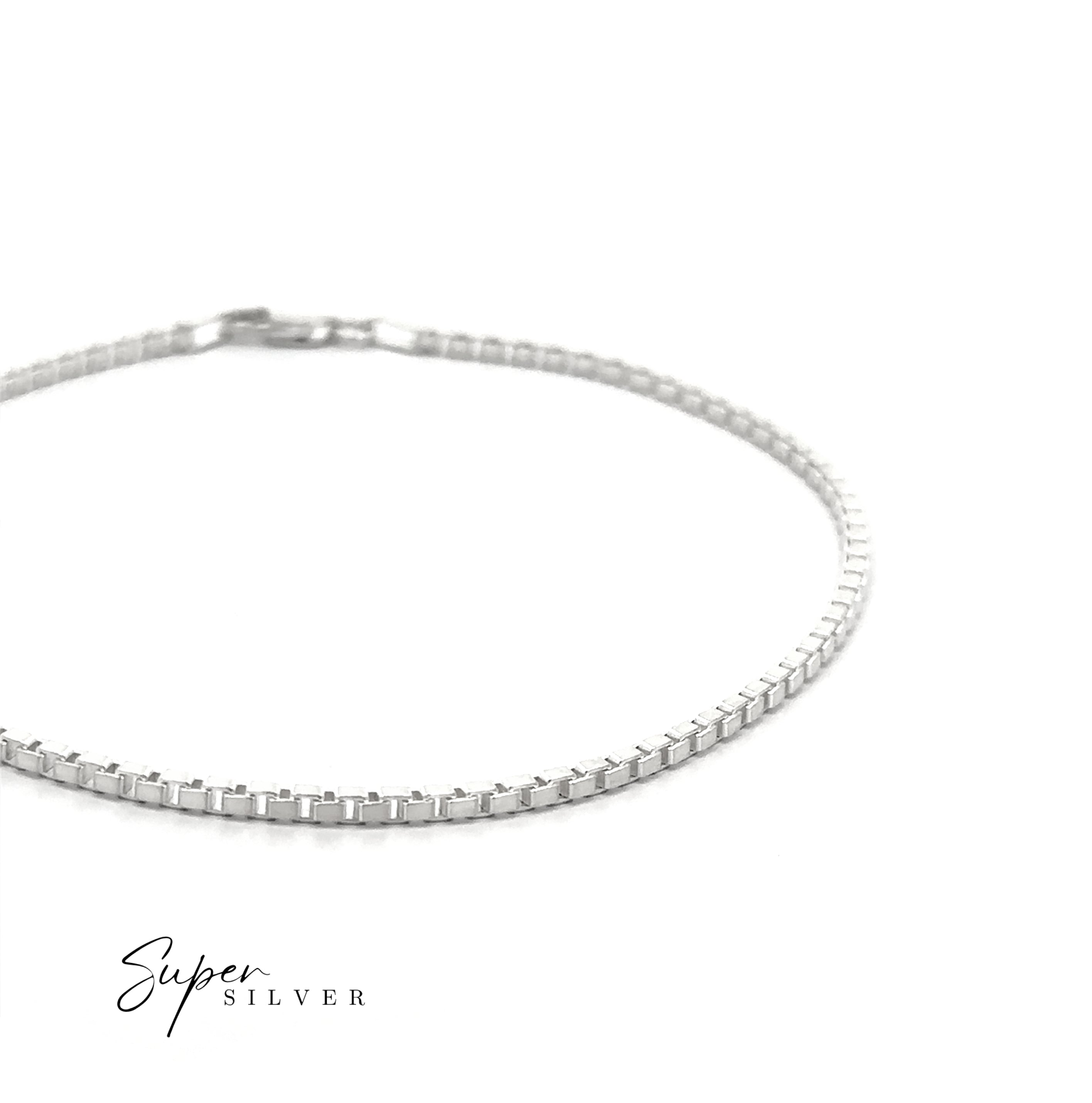 The Bold Italian Box Chain, a sleek sterling silver bracelet, is displayed on a white background, highlighting minimalist elegance. The "Super Silver" logo is shown in the lower left corner.
