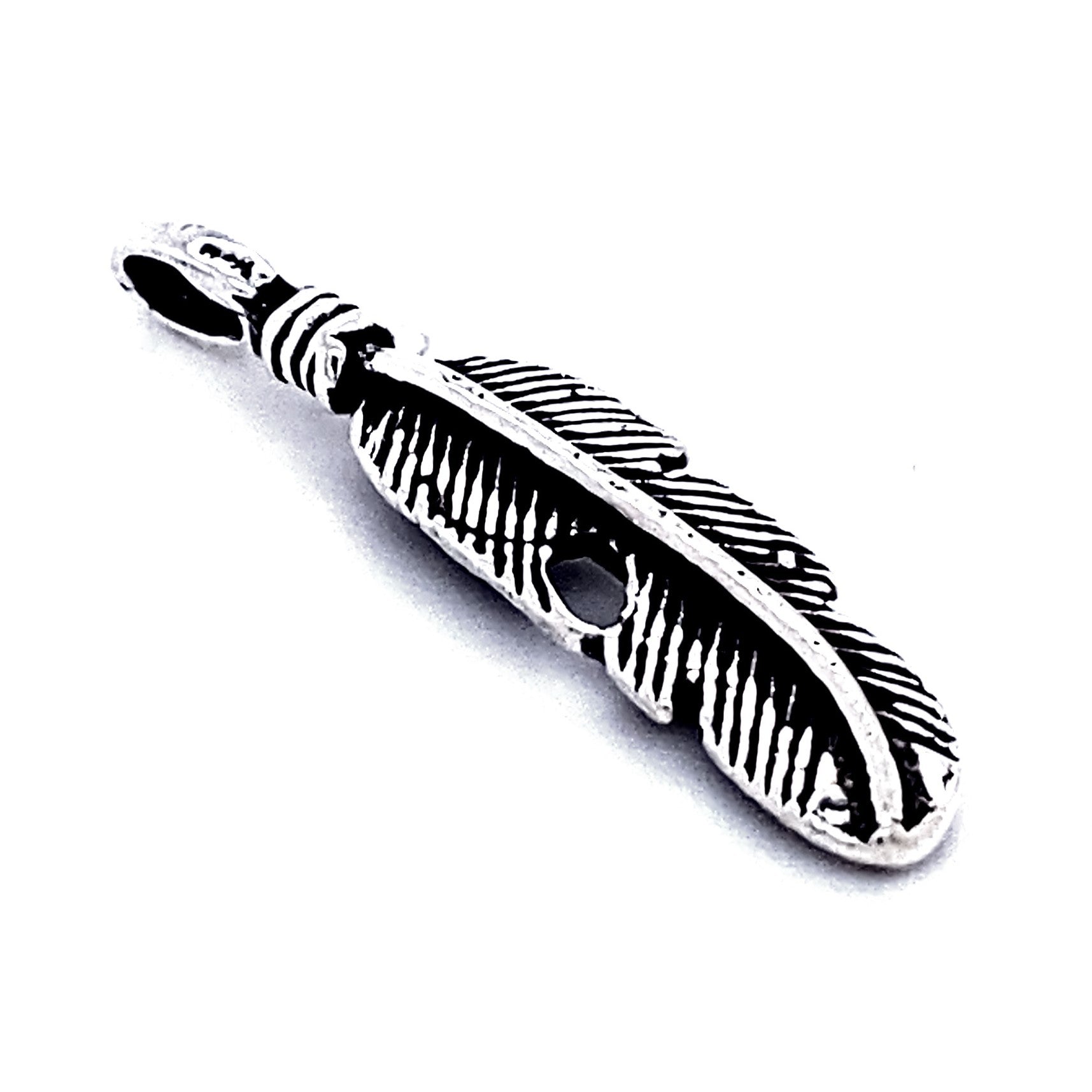 A sterling silver charm, this Curved Feather Pendant boasts intricate detailing and a loop at the top for a chain or cord, creating an elegant bohemian necklace.