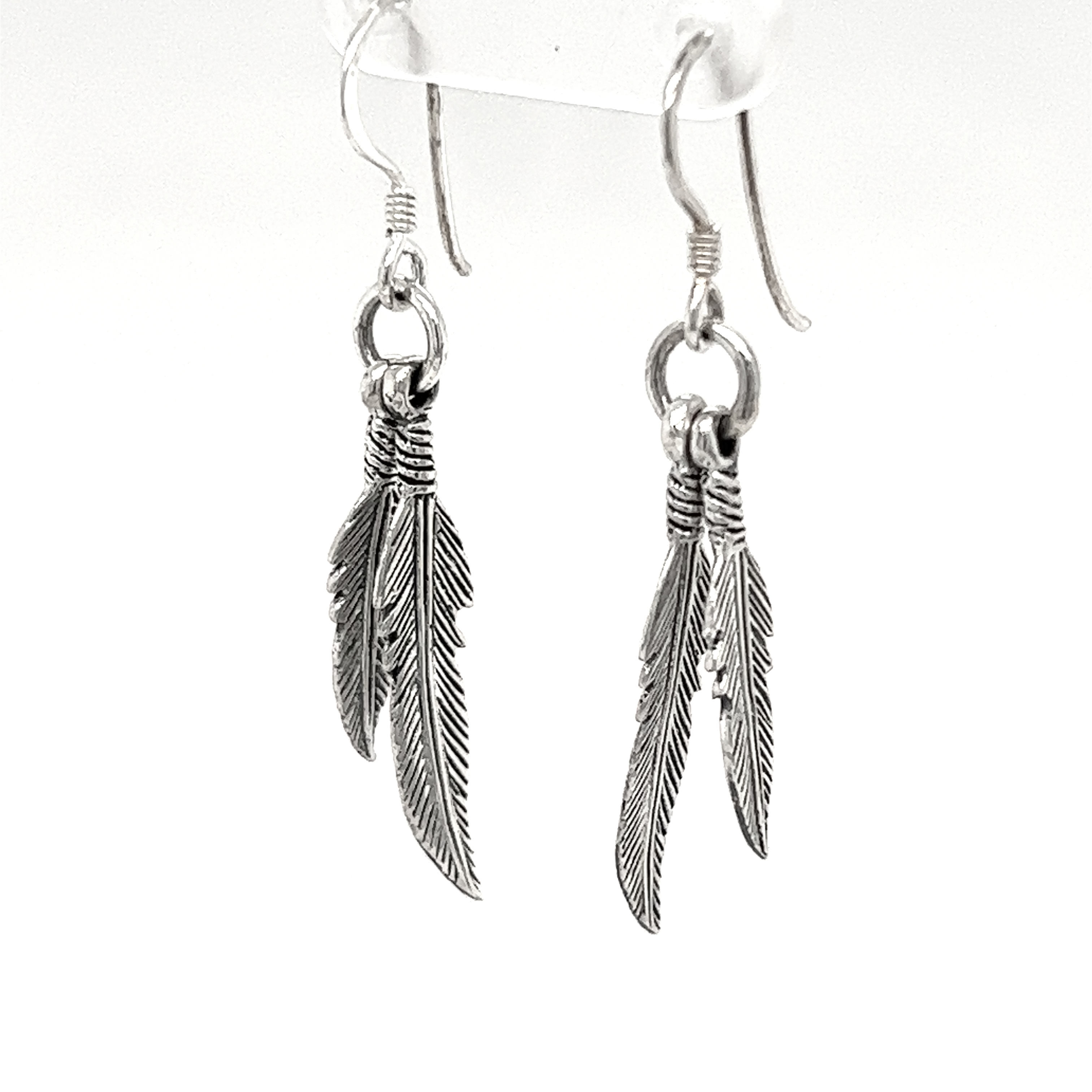 A pair of Super Silver Double Feather Earrings with french hooks.