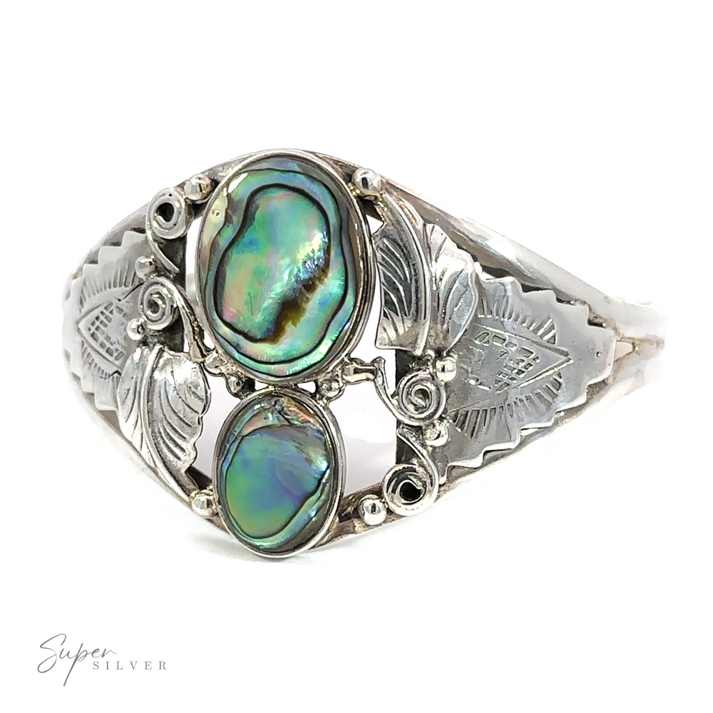 A sterling silver ring adorned with an Abalone Two Ovals with Flowers Bracelet.