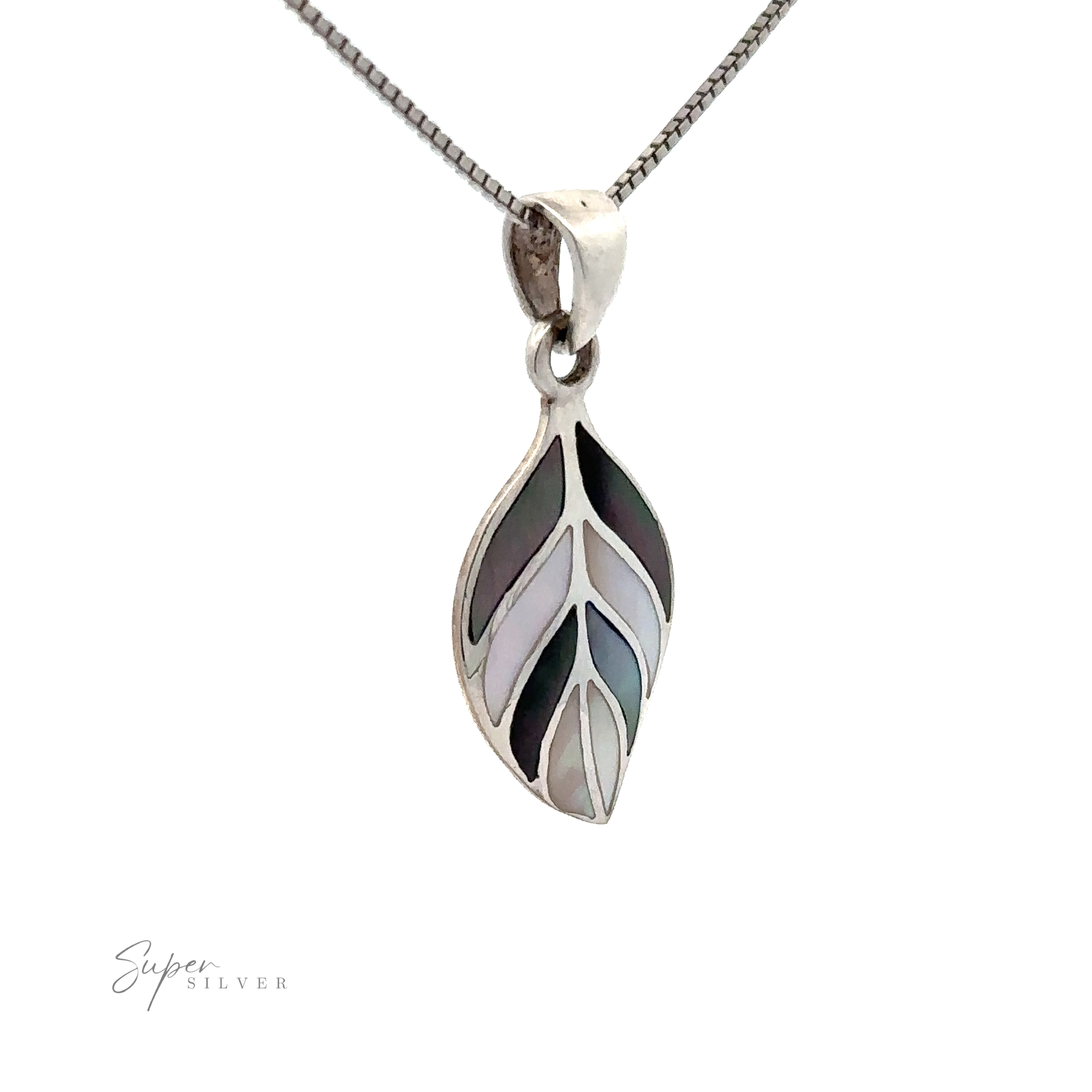 Stone Inlaid Leaf Pendant: This silver necklace features a leaf-shaped pendant with inlaid mother-of-pearl accents, hanging gracefully on a fine chain against a white background.