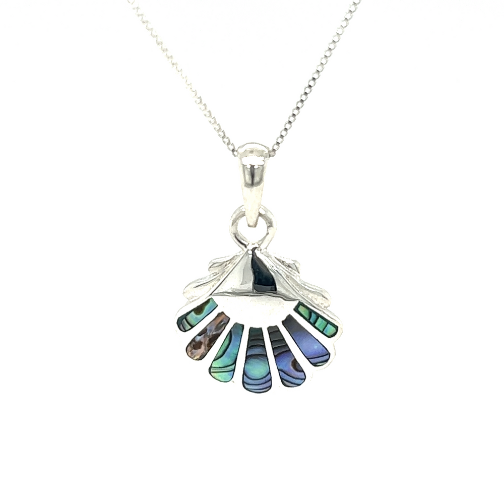 
                  
                    An oceanic beauty, this Clam Shell Pendant features inlay stones of blue and green, creating a stunning accessory.
                  
                