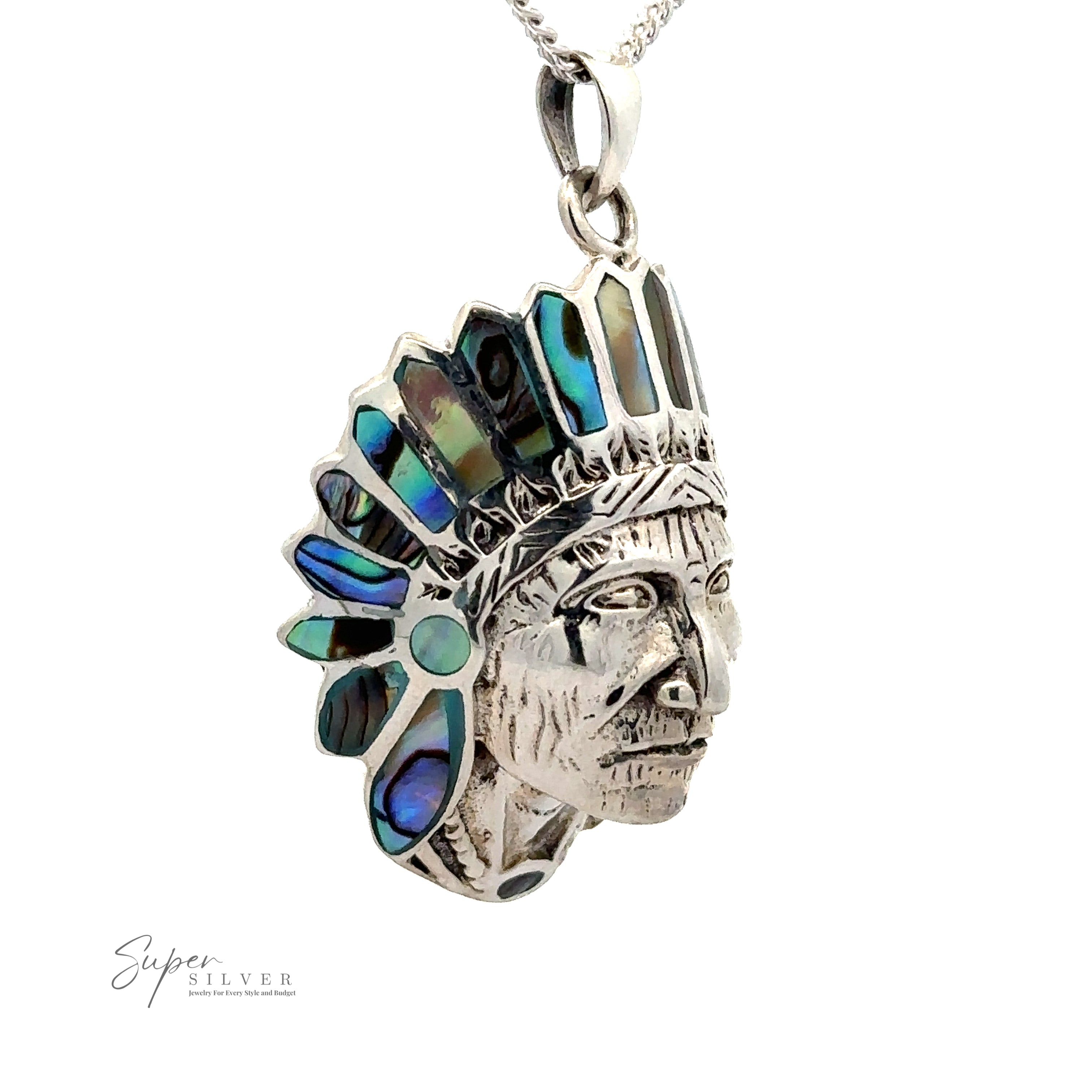 A stunning Chief Pendant With Inlaid Stones in the shape of a Native American chief's head, featuring intricate silver detailing and iridescent abalone turquoise inlays.