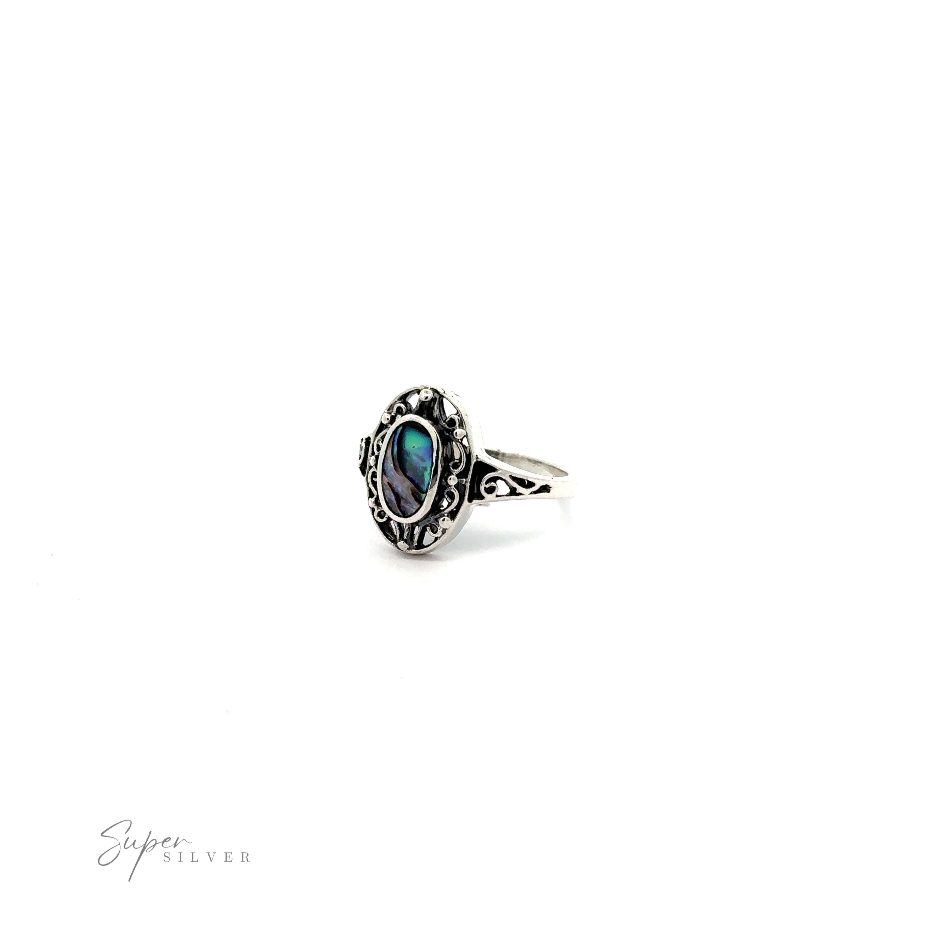 A sterling silver ring with an Oval Inlay Stone with Swirl Filigree Border in the middle.
