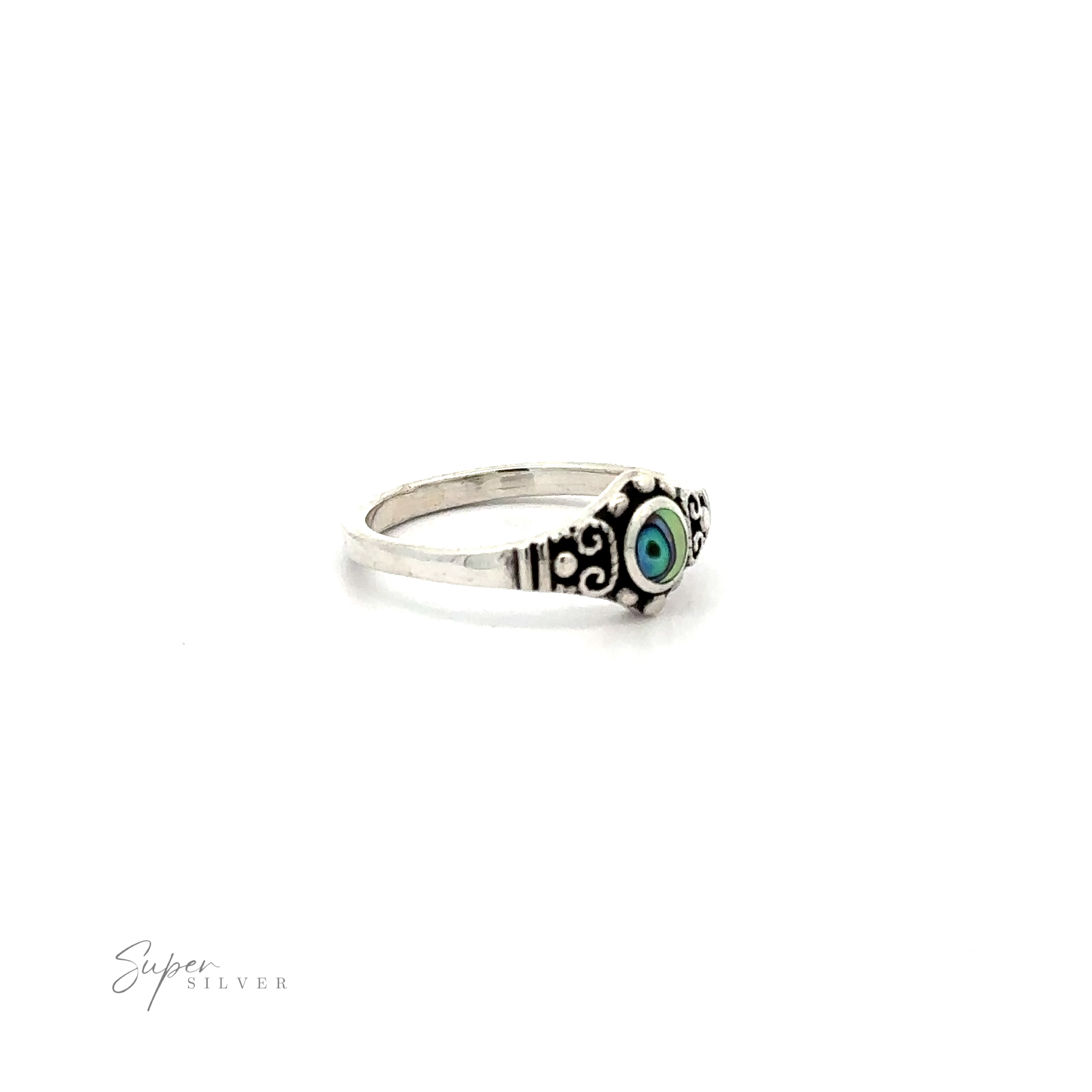 A Dainty Inlaid Stone Ring With Silver Beads and Swirls silver ring with an inlaid blue stone.
