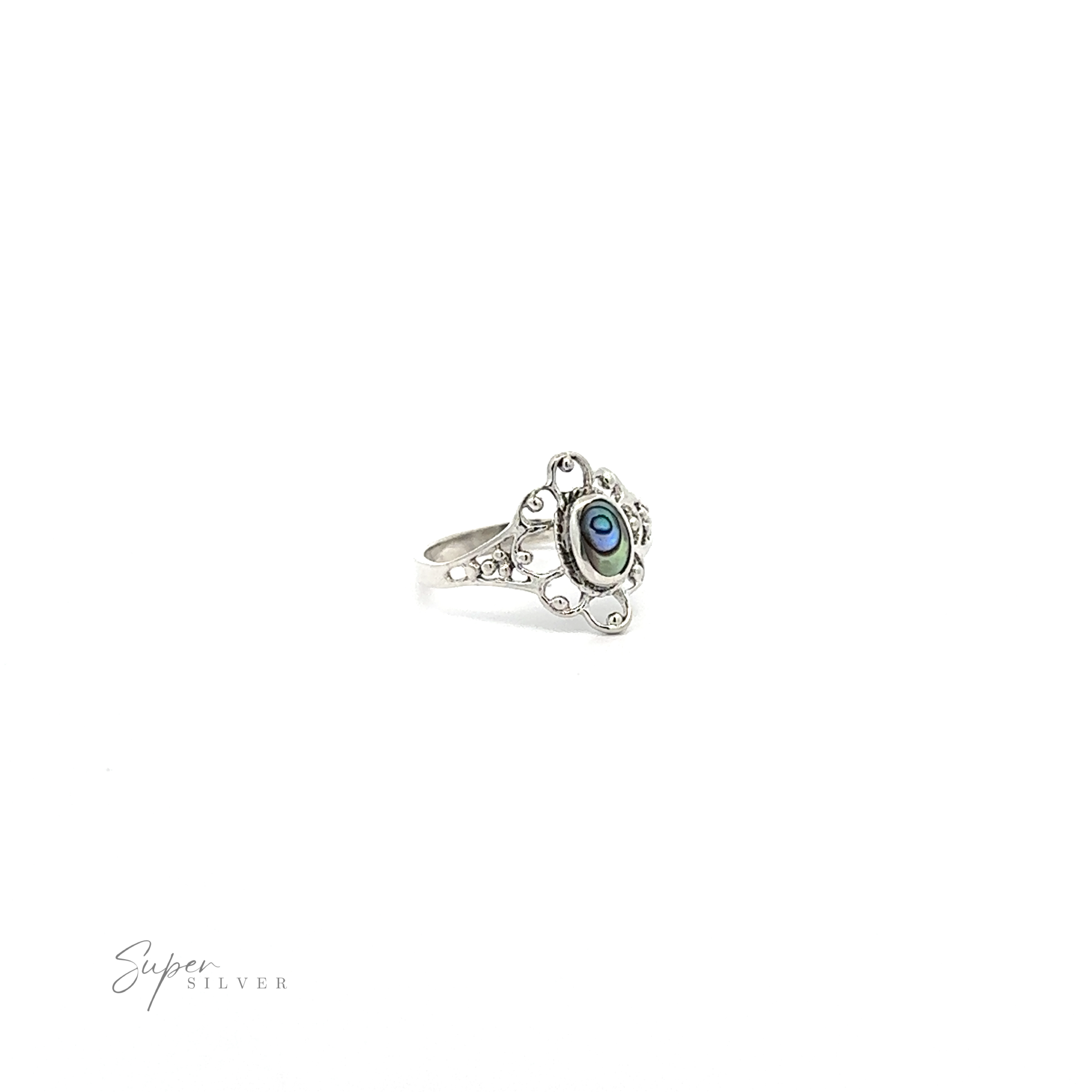 A vintage-styled flower ring with inlaid stones with a blue stone encircled by lacey petals.