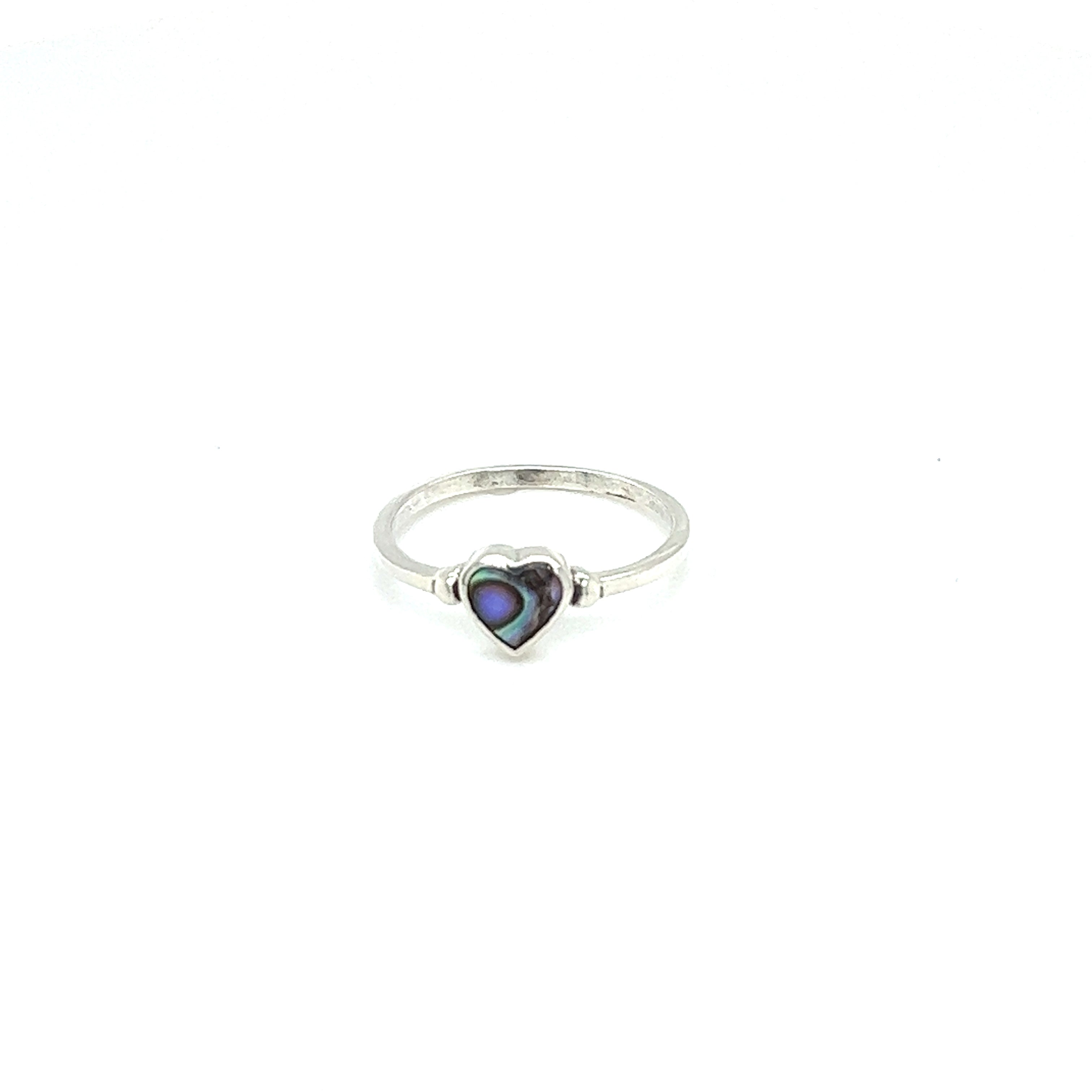 A minimalist Dainty Inlaid Heart Ring featuring an abalone stone inlay.