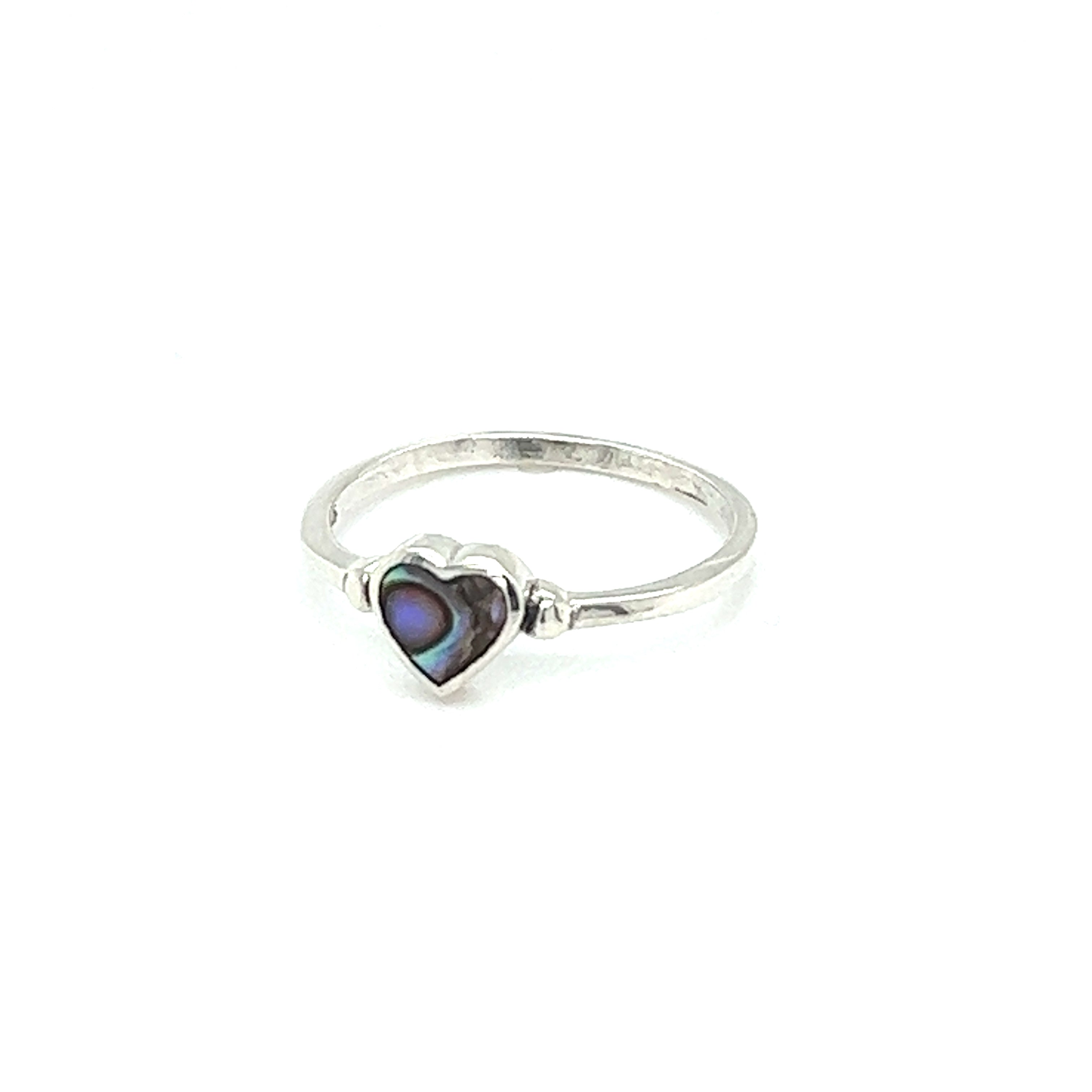 A stunning dainty inlaid heart ring in sterling silver with an exquisite abalone shell inlay.