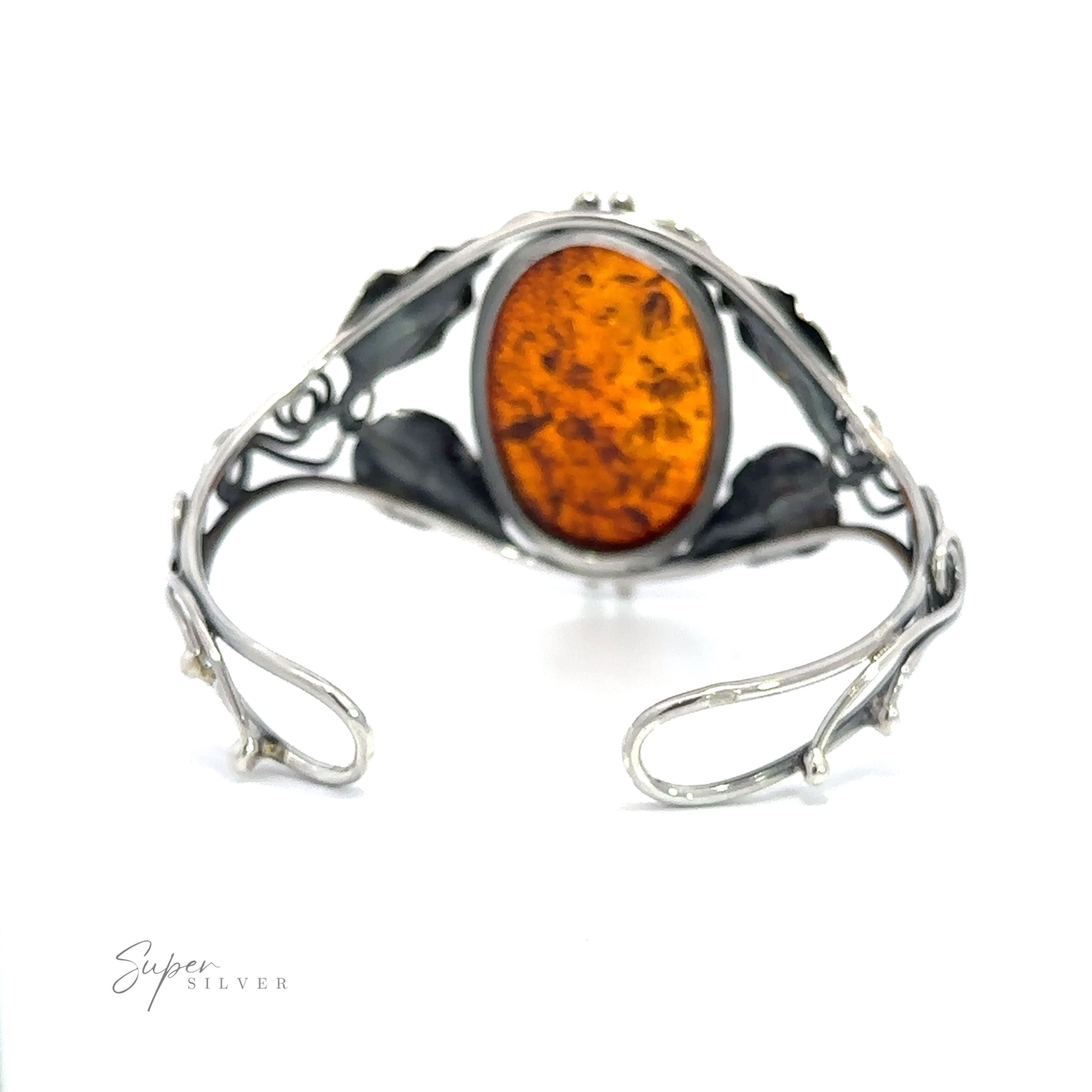 A contemporary design Exquisite Amber Floral Cuff with an Amber stone.