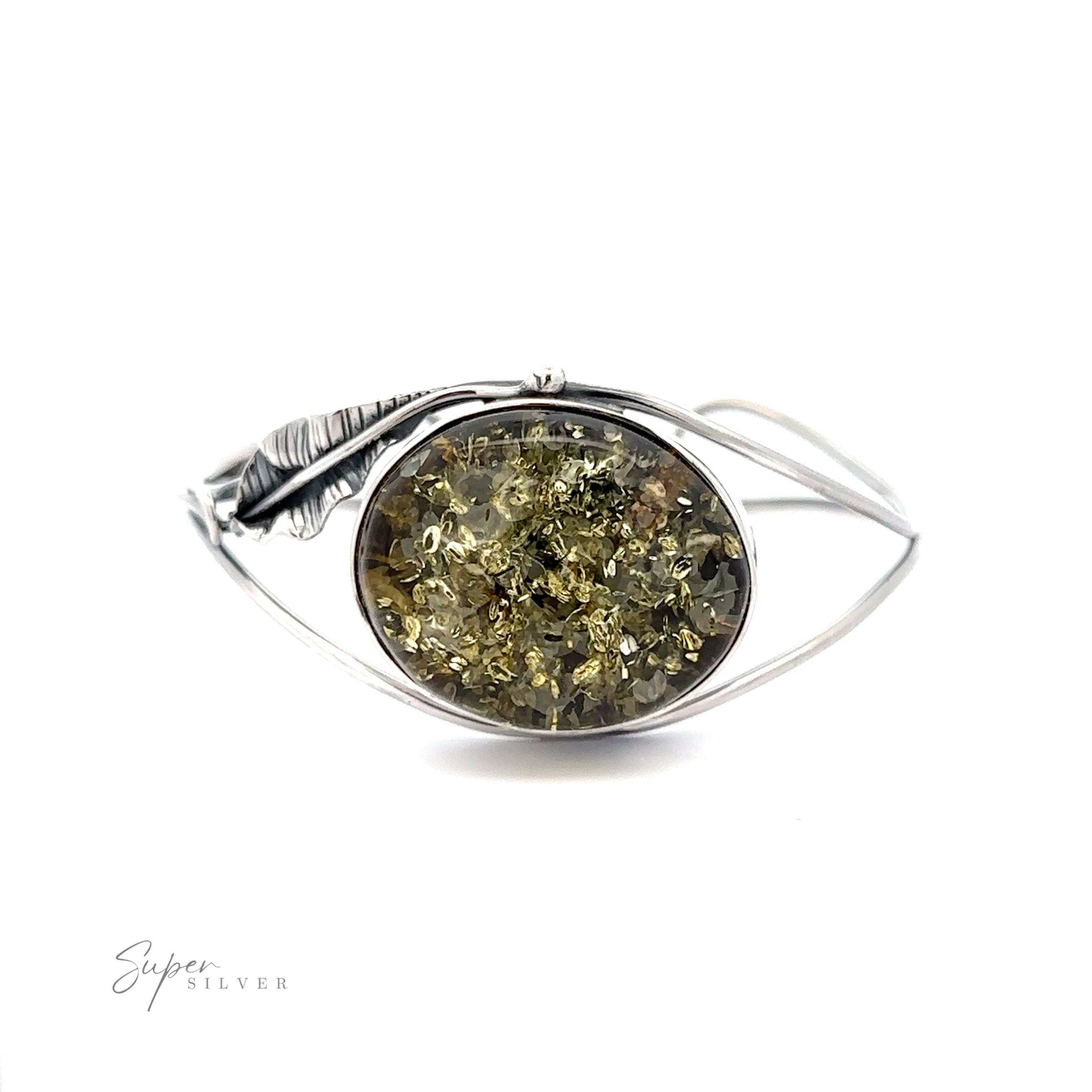 A Delicate Floral Amber Cuff bracelet with a green stone.