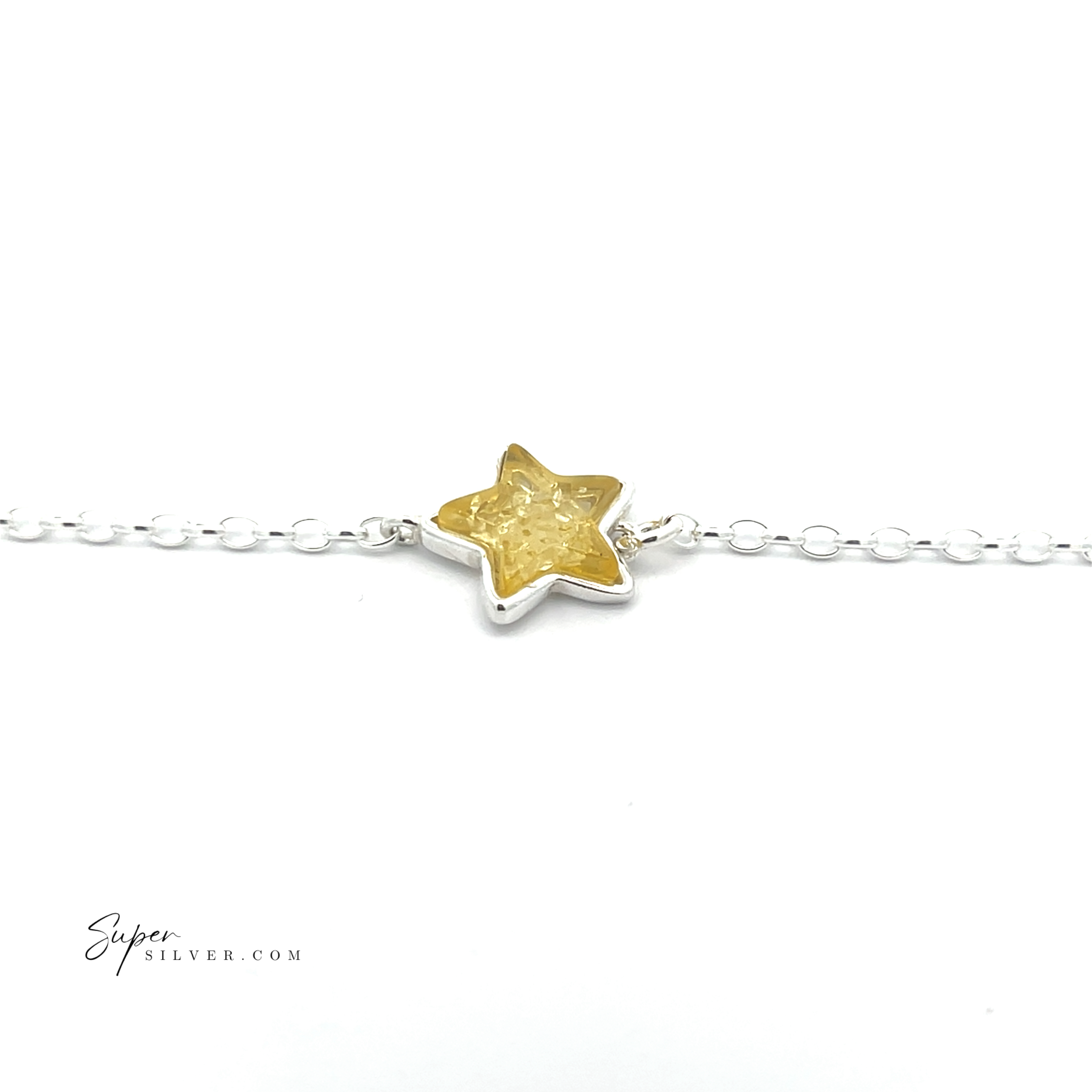 The Simple Amber Star Bracelet showcases a minimalist sterling silver chain with a vibrant yellow star-shaped charm at its center.