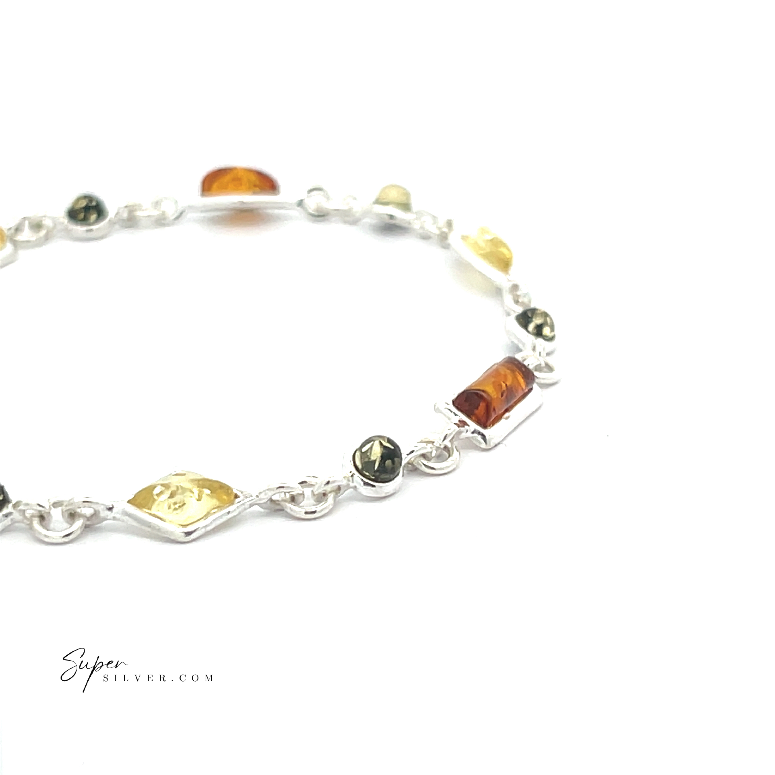 The Dainty Eclectic Baltic Amber Bracelet features oval and rectangular yellow, green, and orange stones on a white background. "Supersilver.com" text is in the lower left—a truly unique piece of jewelry.