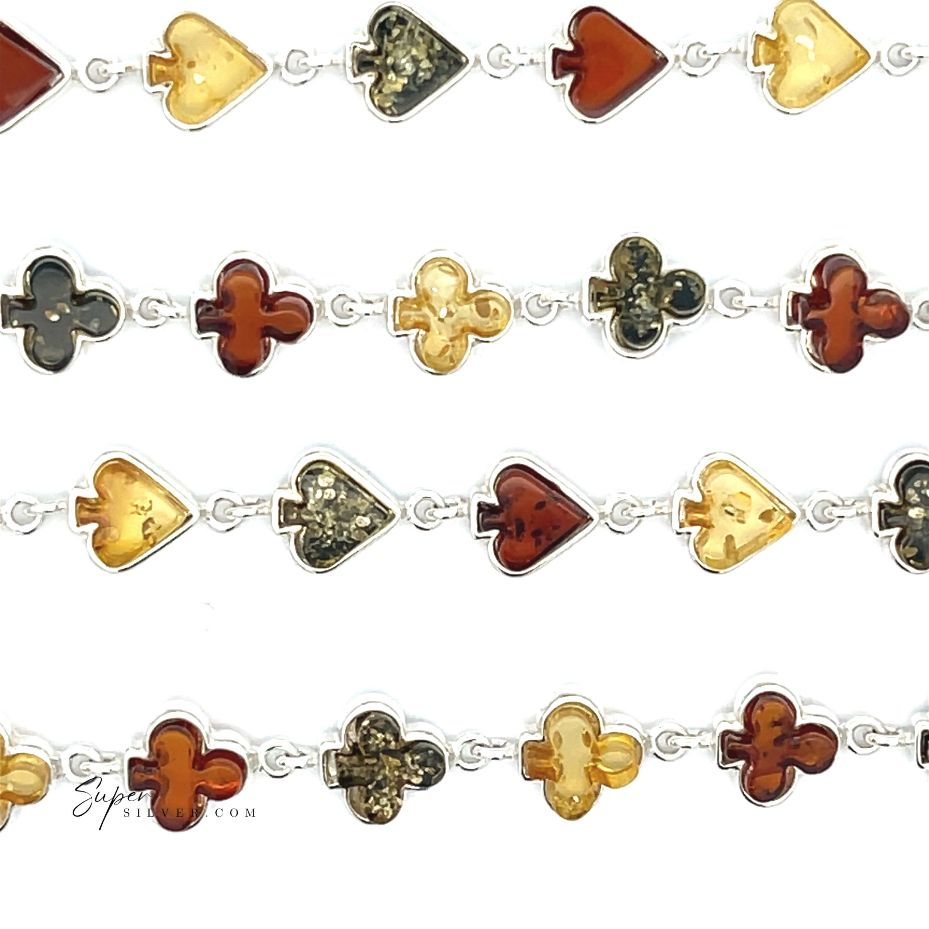 Amber Card Suit Bracelets feature sterling silver links with heart and club-shaped Baltic amber pendants in yellow, brown, and black, creating a playful card suit vibe on a white background.