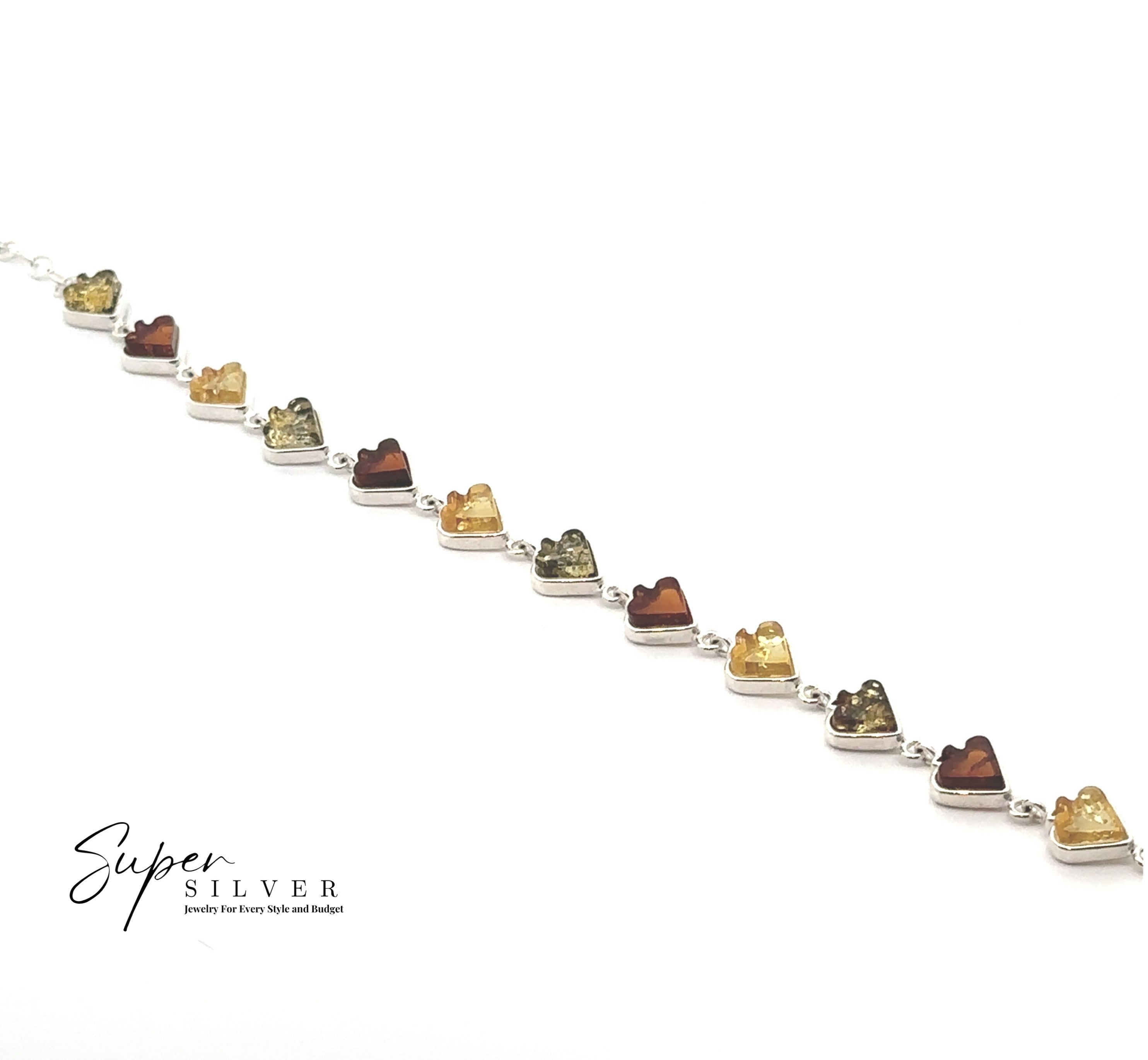 The Amber Card Suit Bracelets showcase alternating heart-shaped Baltic amber stones in amber, yellow, and green hues, set in sterling silver and featured on a white background with a "Super Silver" logo in the corner.