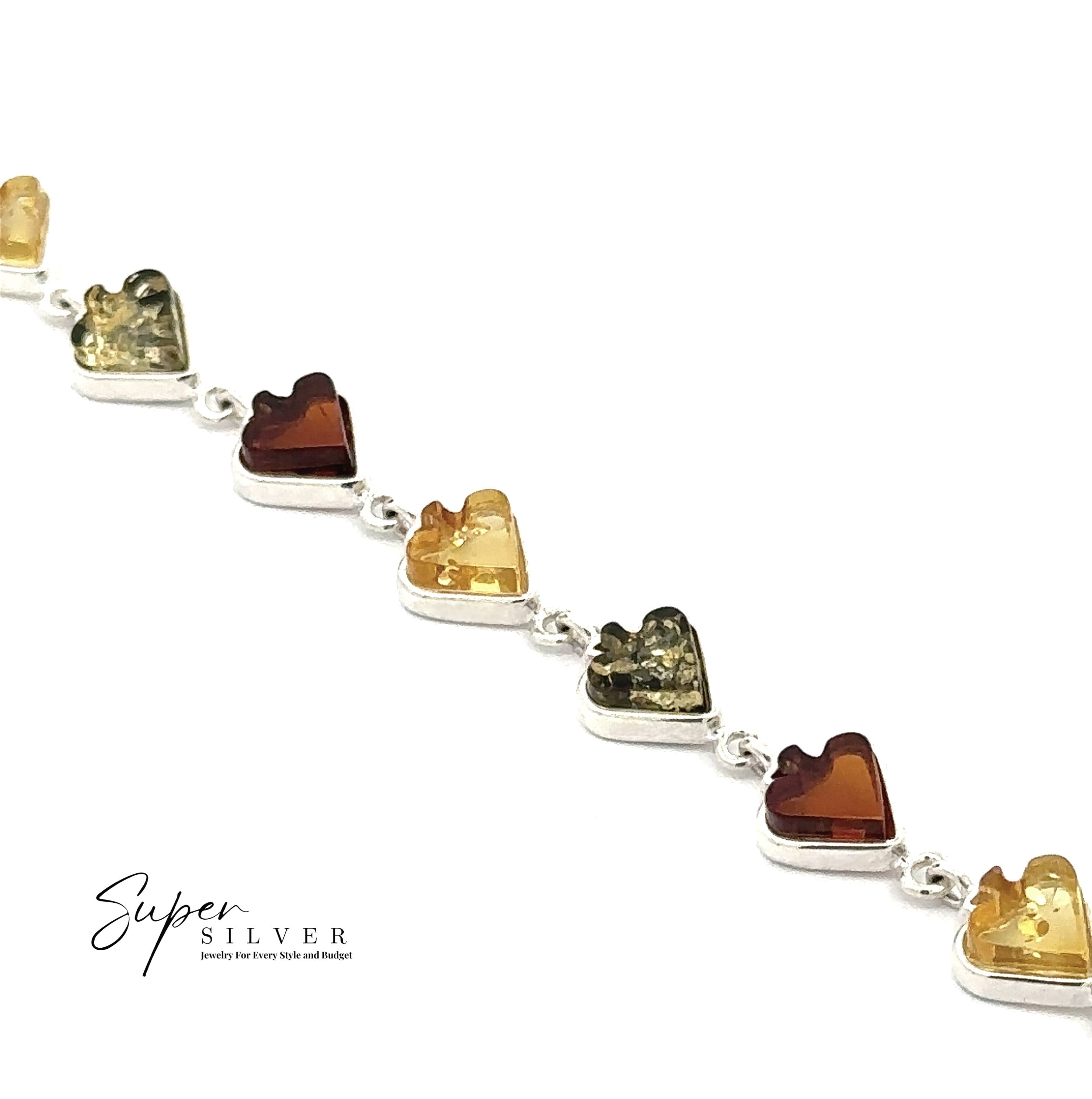 The Amber Card Suit Bracelets, crafted in sterling silver with Baltic amber charms in yellow, green, and dark tones, are shown diagonally on a white background. The "Super Silver" logo is in the bottom left corner.