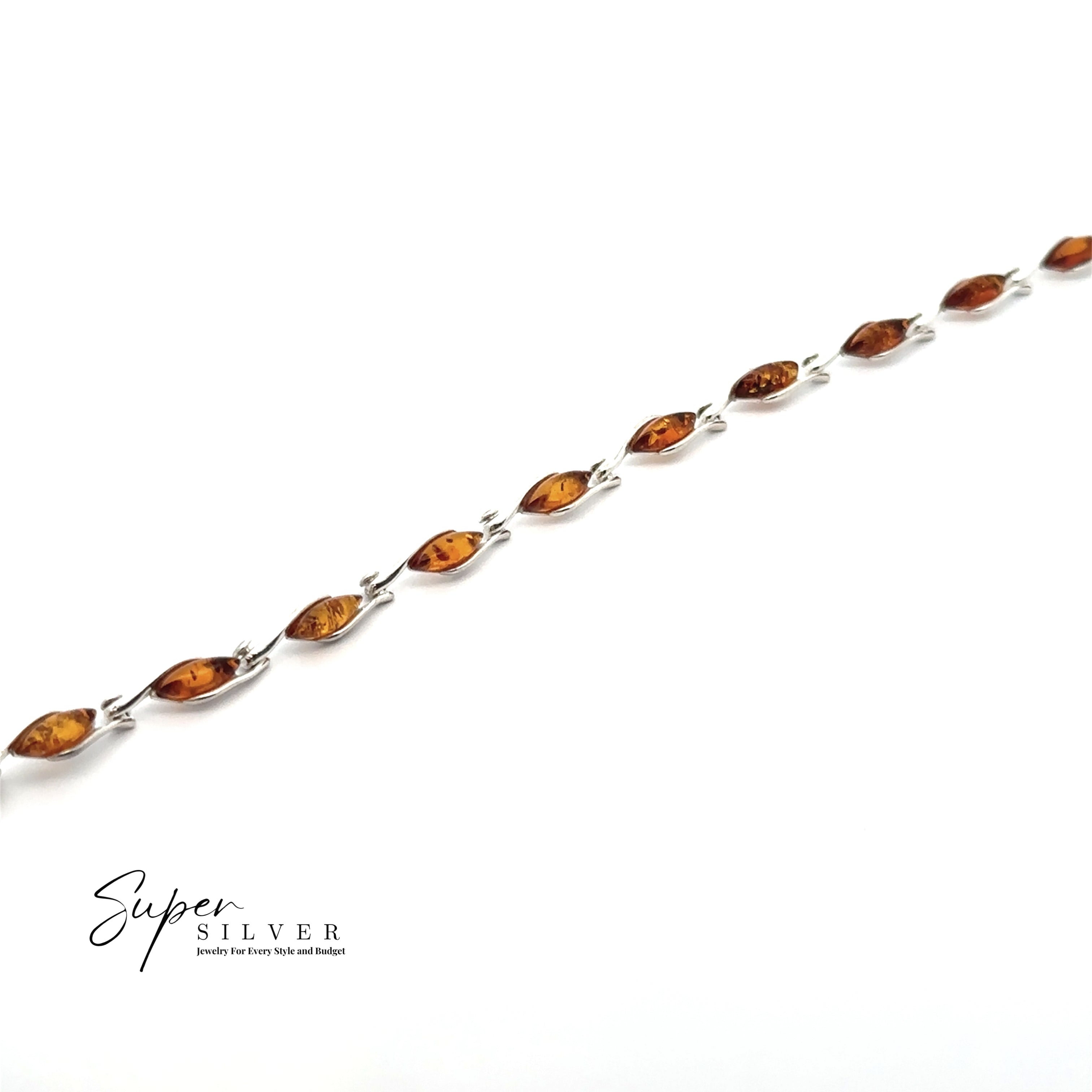 The Baltic Amber Marquise Bracelet, crafted in sterling silver with marquise-shaped cognac amber links, is displayed diagonally on a white background. The "Super Silver" logo appears in the lower left corner.