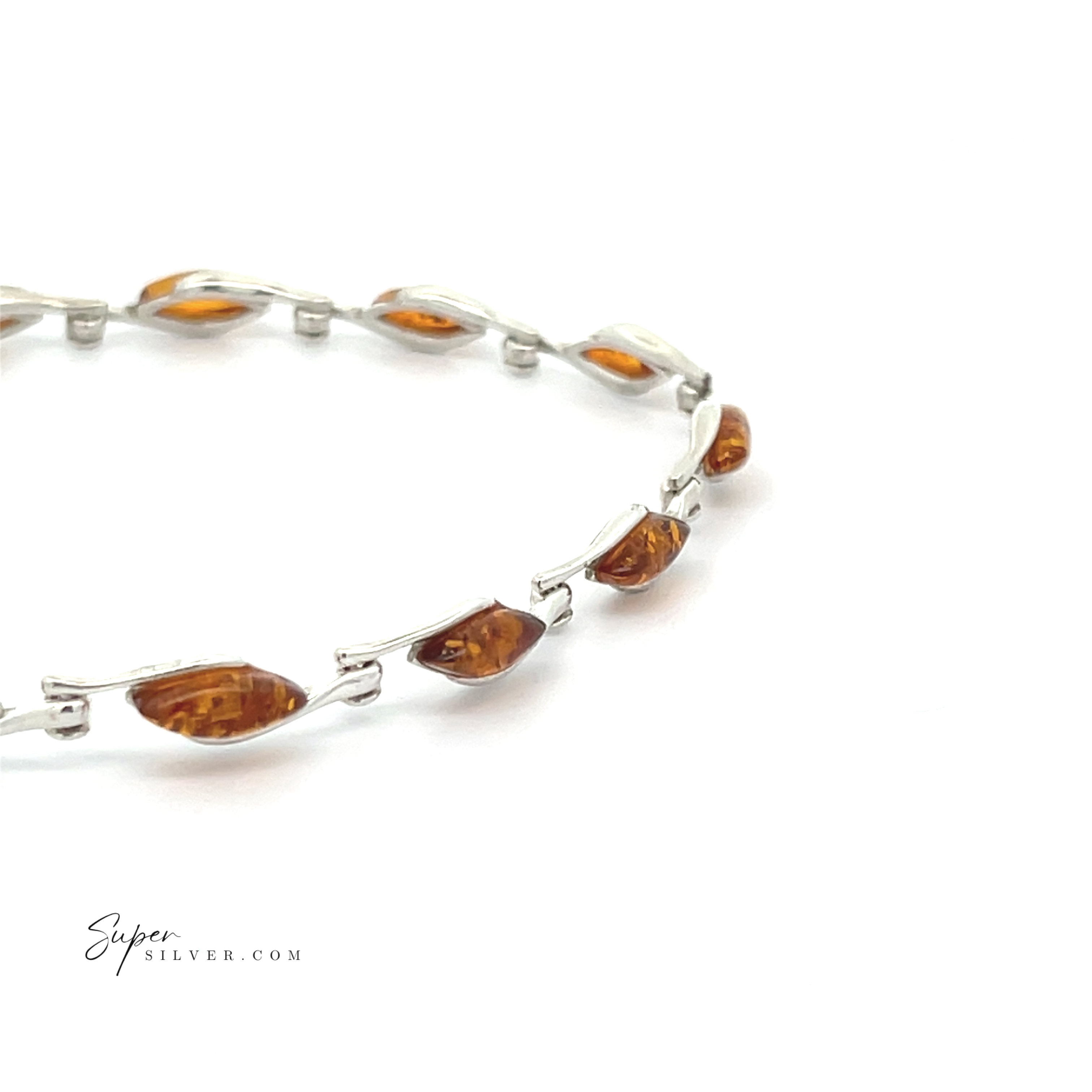 The Baltic Amber Marquise Bracelet features marquise-shaped cognac amber stones set in sterling silver, evenly spaced along the band and shown against a white background.