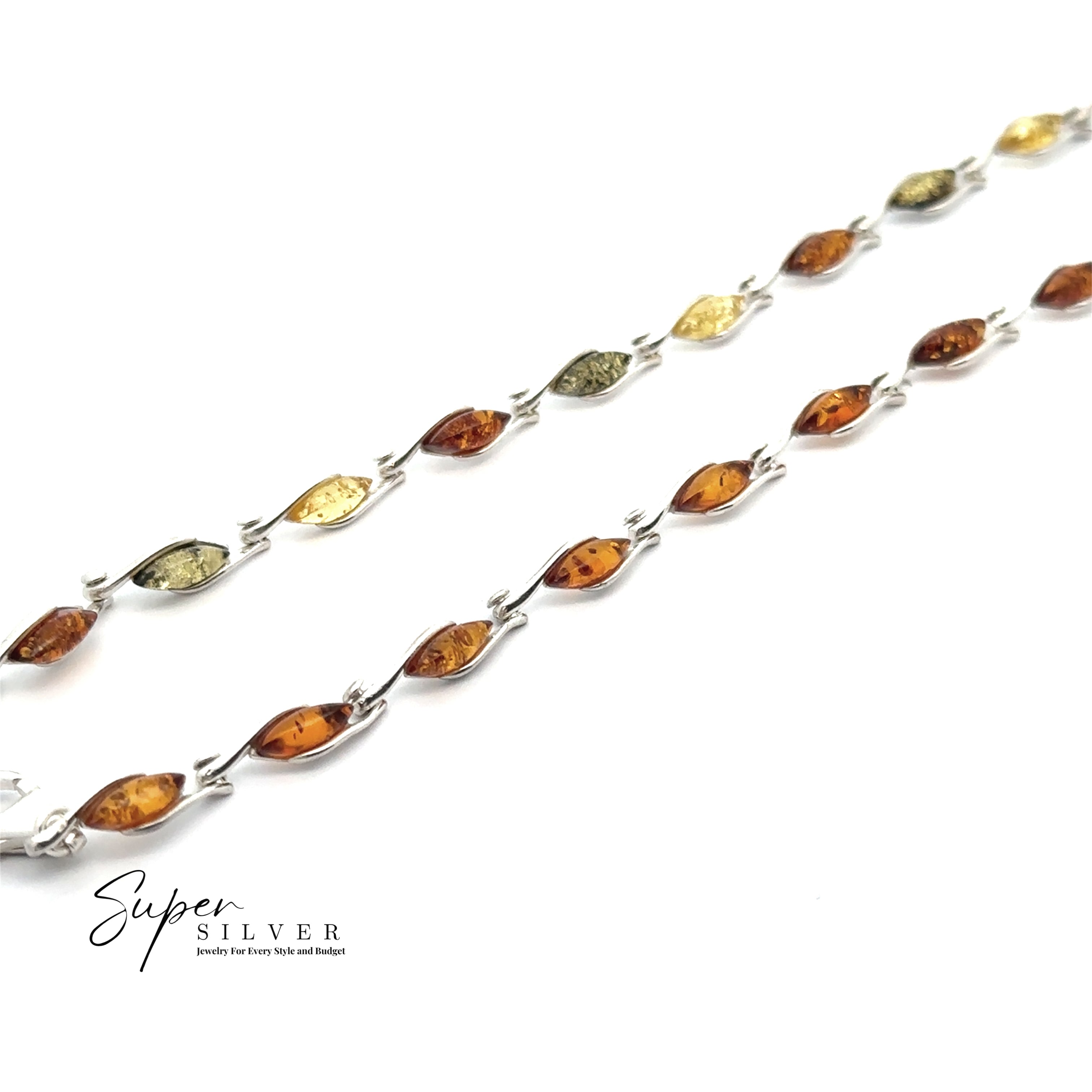 Two Baltic Amber Marquise Bracelets featuring sterling silver chains with marquise-shaped cognac amber and yellow stones are arranged diagonally on a white background. The "Super Silver" logo appears in the lower left corner.