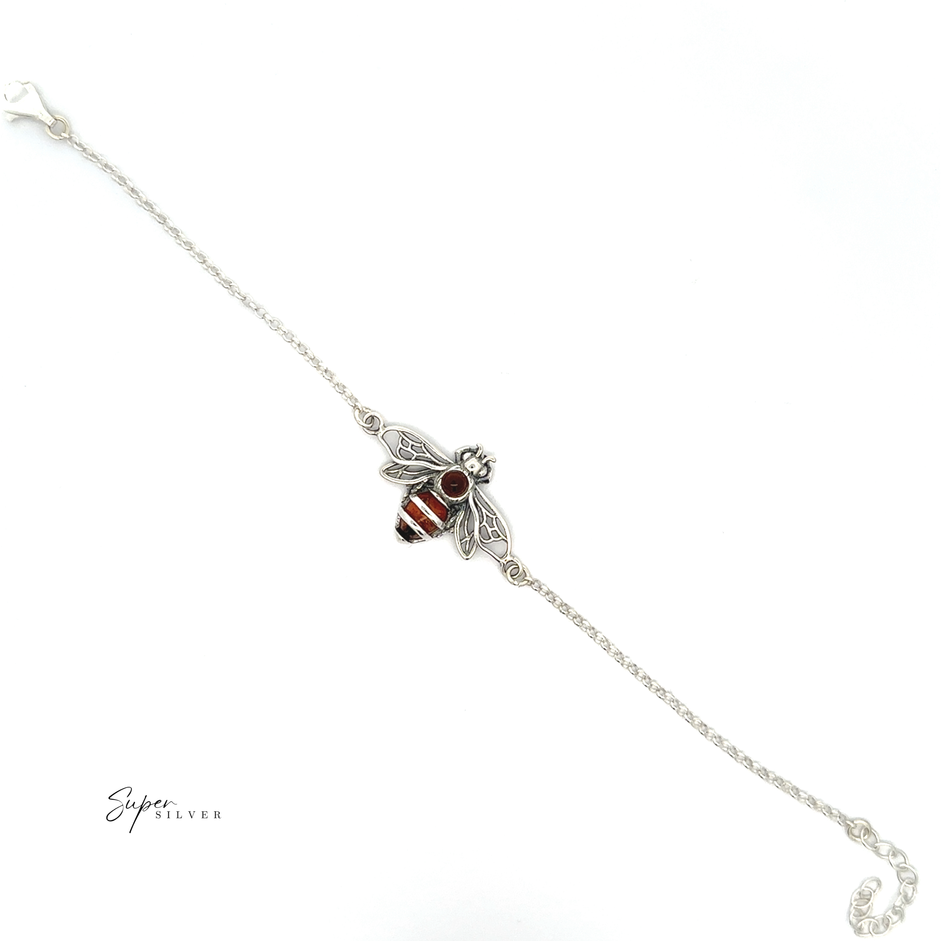 The Baltic Amber Honeybee Bracelet is a delicate sterling silver piece with a bee-shaped centerpiece featuring red and black accents, displayed on a white background.