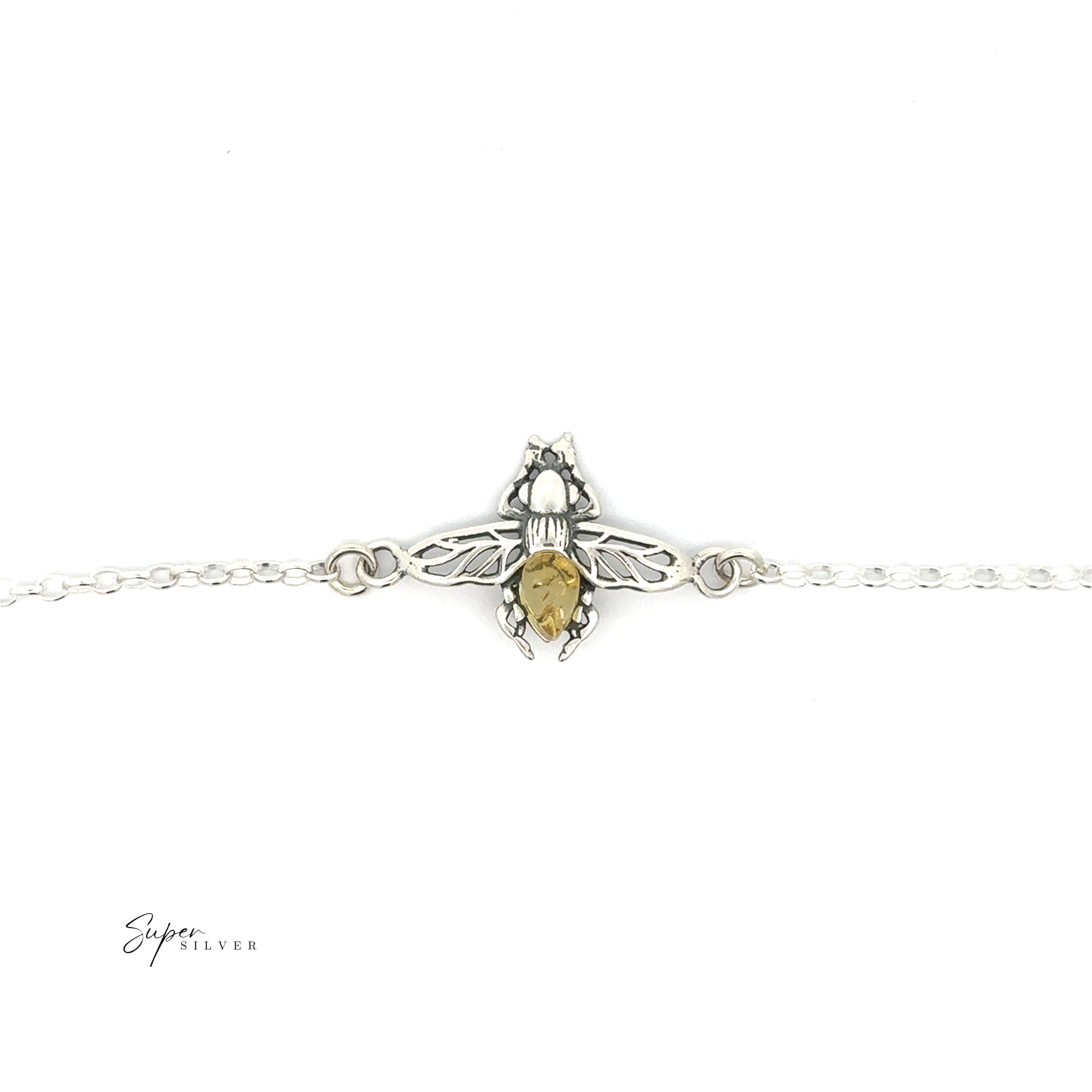 The Baltic Amber Bee Bracelet features a sterling silver bee with a yellow Baltic amber body on a delicate silver chain, displayed against a white background.