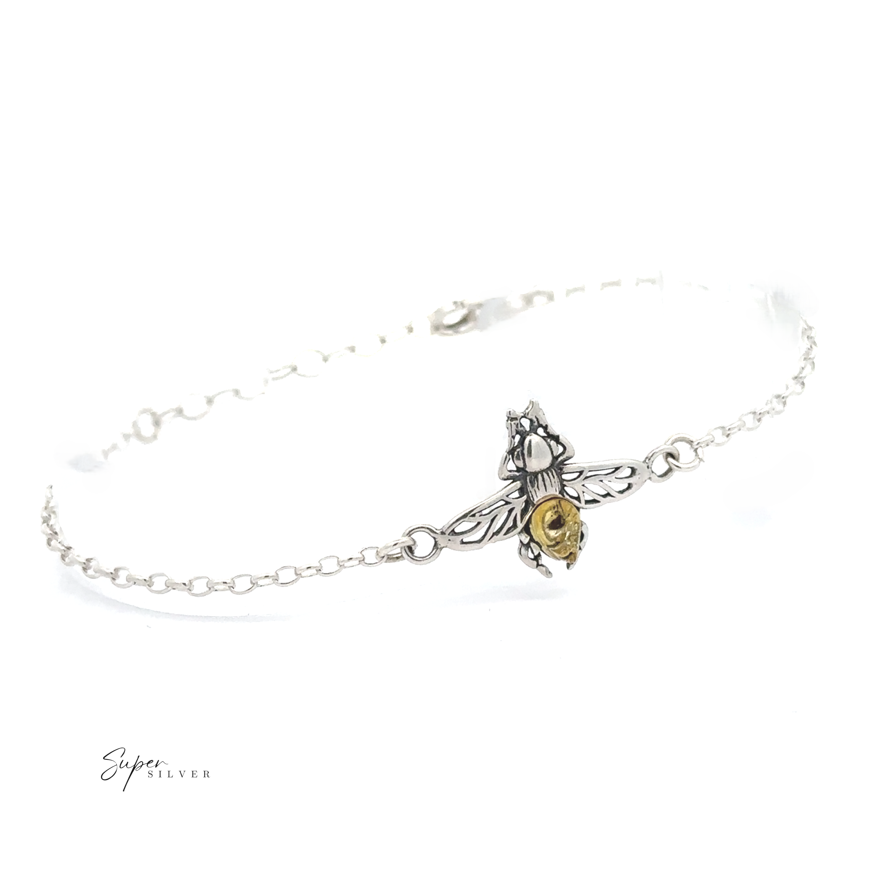 The Baltic Amber Bee Bracelet is a delicate sterling silver chain bracelet with a bee charm, detailed wings, and a small gold-toned accent on its body.