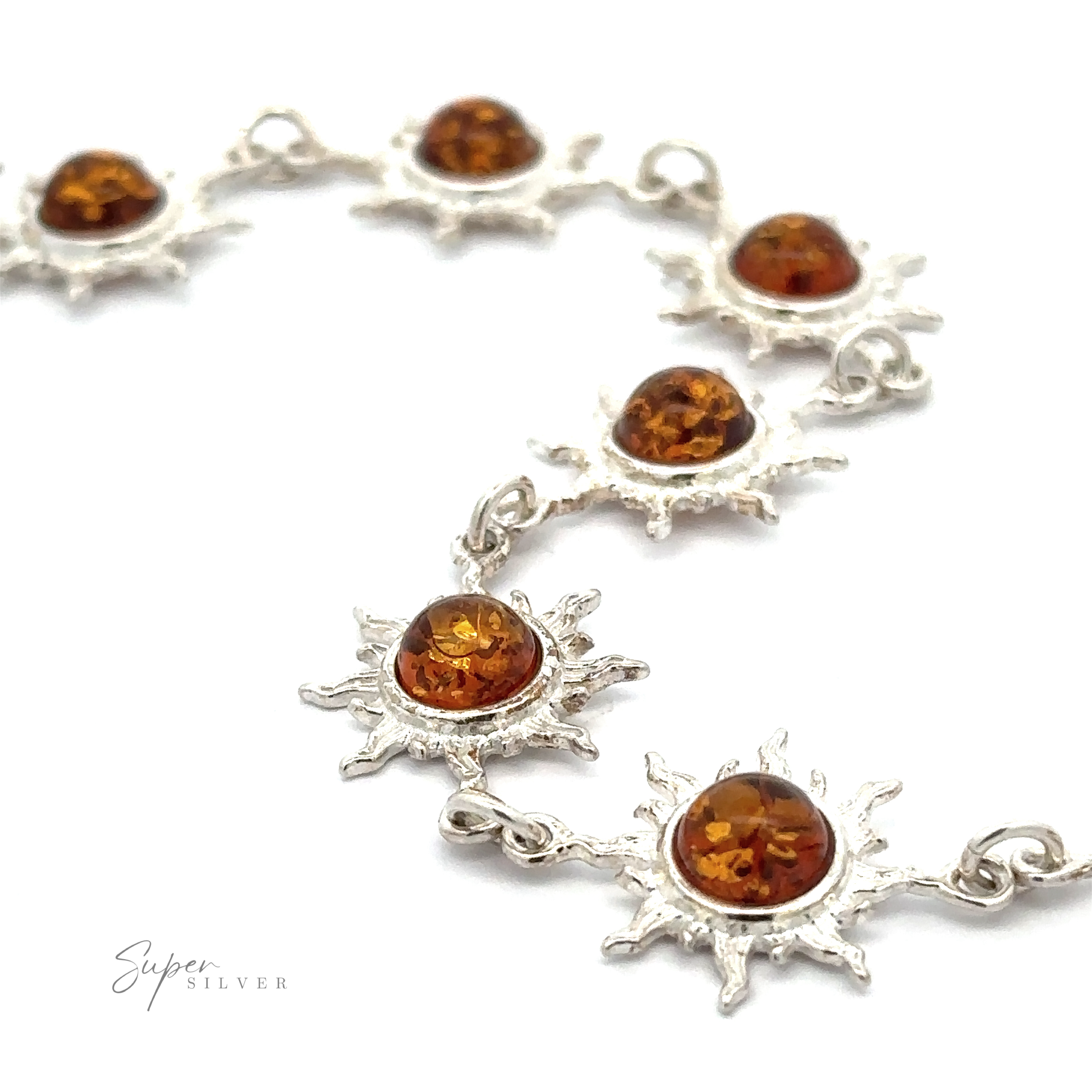 A stunning Sparkling Amber Sun Bracelet featuring rich cognac amber stones set in sterling silver.