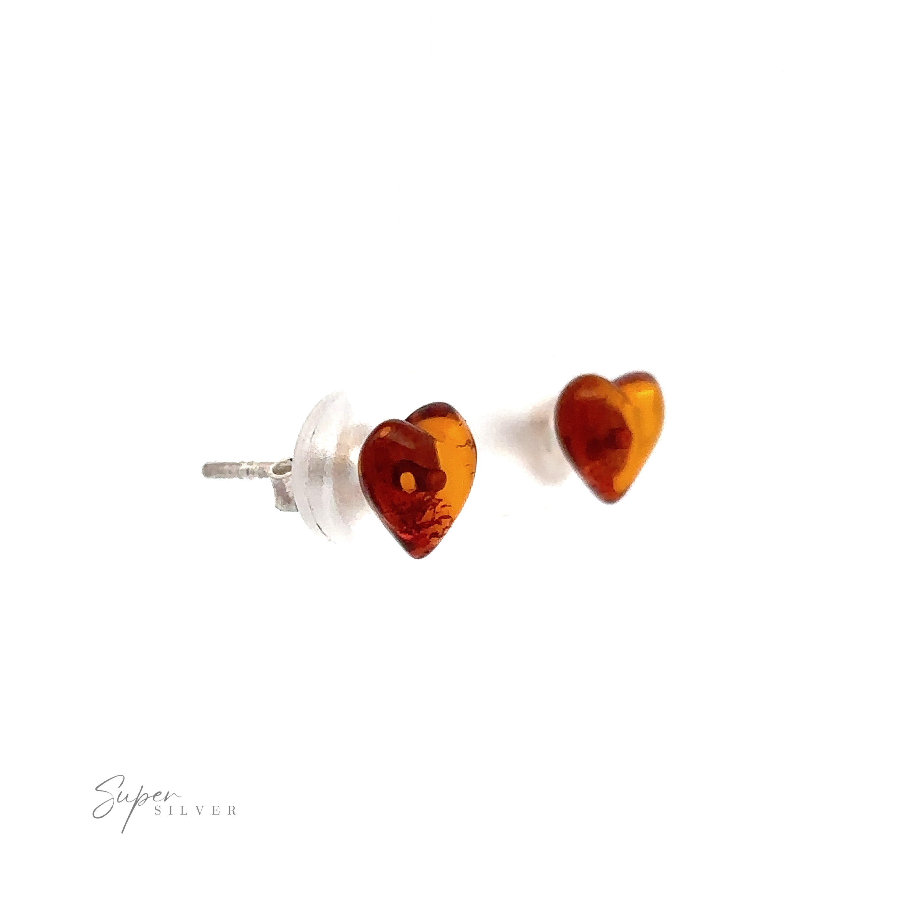 A pair of Amber Heart Studs with silver posts and clear backs on a white background. The text "Super Silver" is in the lower left corner.