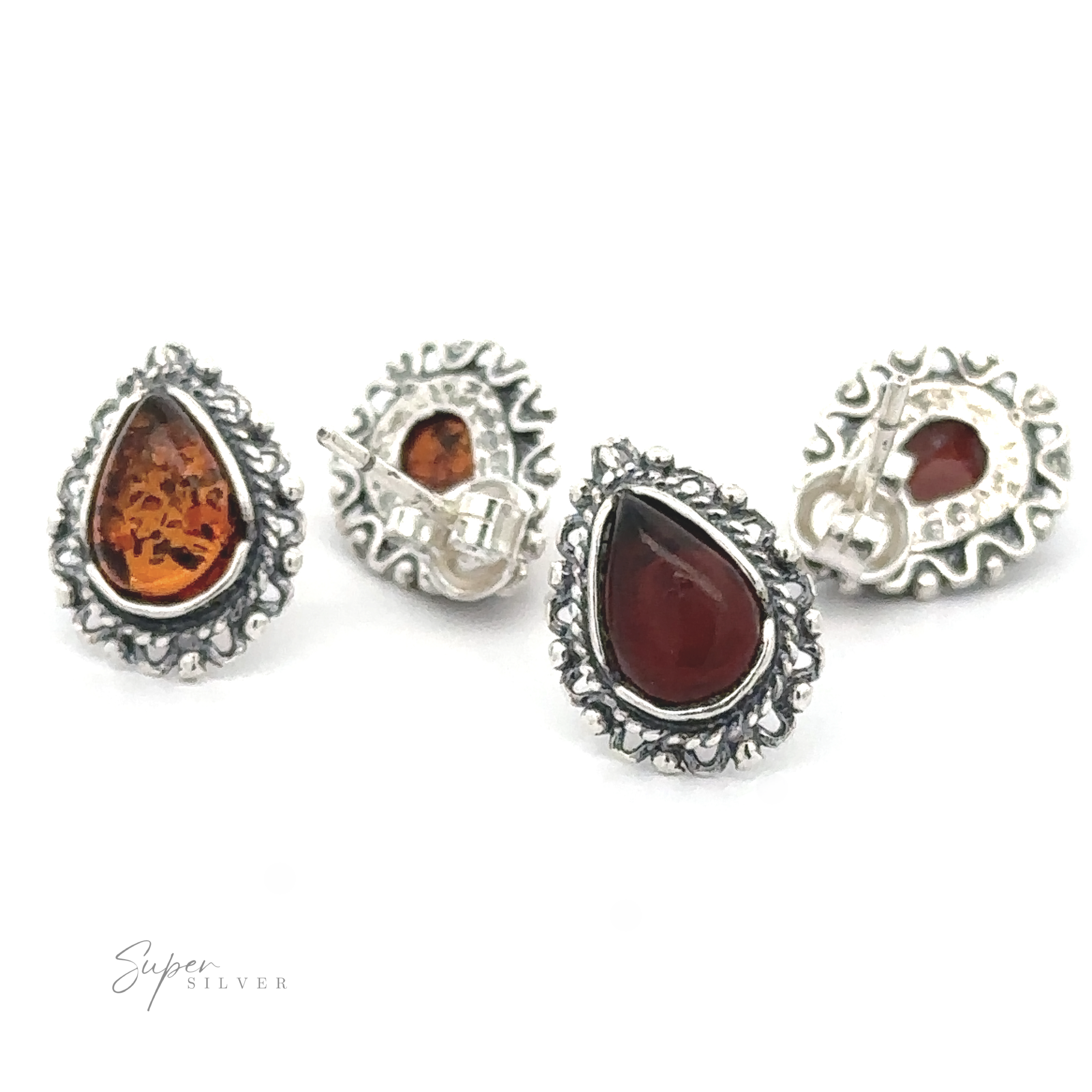 Four Framed Teardrop Amber Studs with intricate designs and teardrop-shaped Baltic amber stones, displayed on a white background. The brand name "Super Silver" is visible in the bottom left corner, evoking a sense of vintage romance.