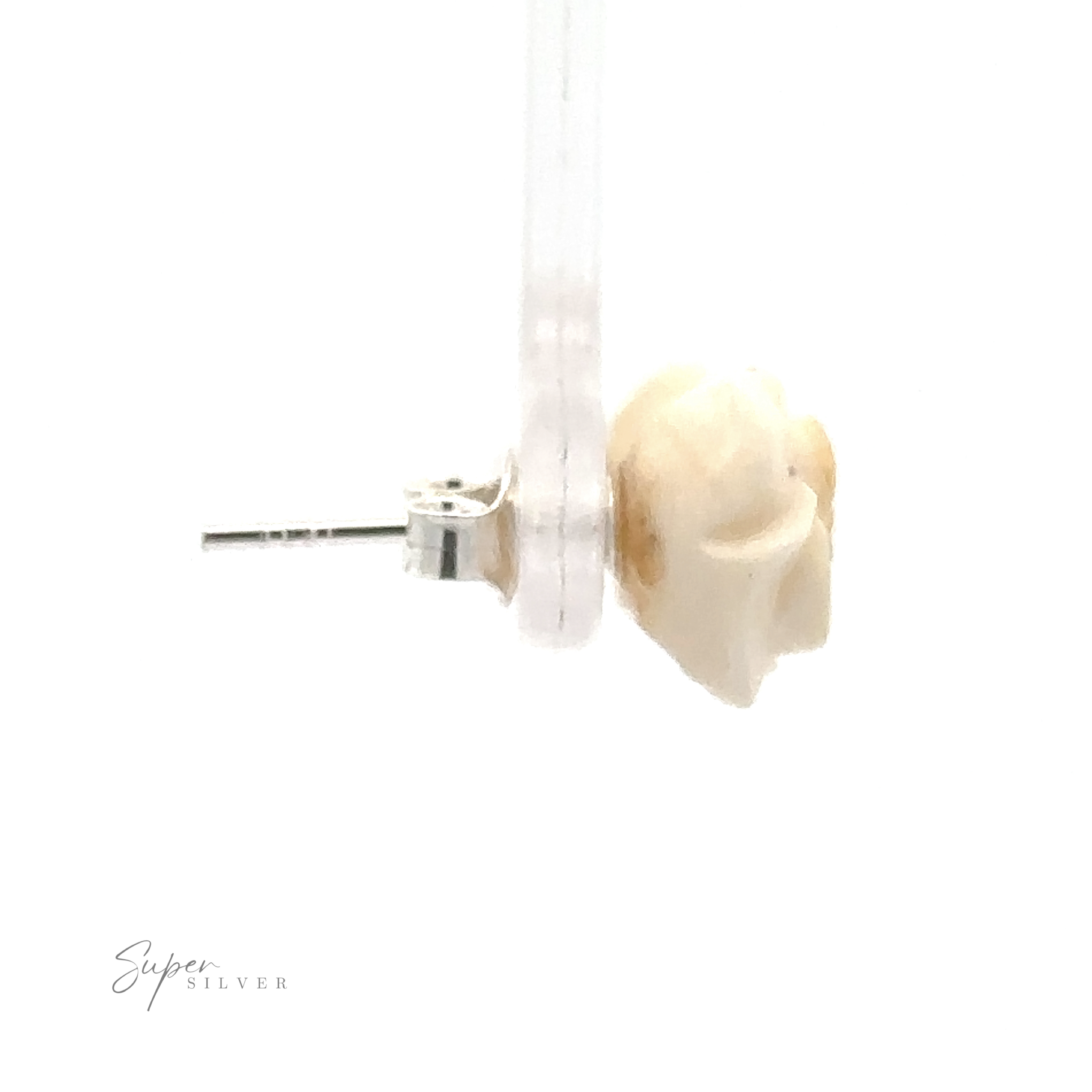 Close-up of a single stud earring with a white rose design, reminiscent of Butterscotch Amber Rose Studs, attached to a transparent stand. The left side includes a pin for fastening. "Super Silver" is written in the bottom left corner, highlighting its quality as part of Sterling Silver Earrings.