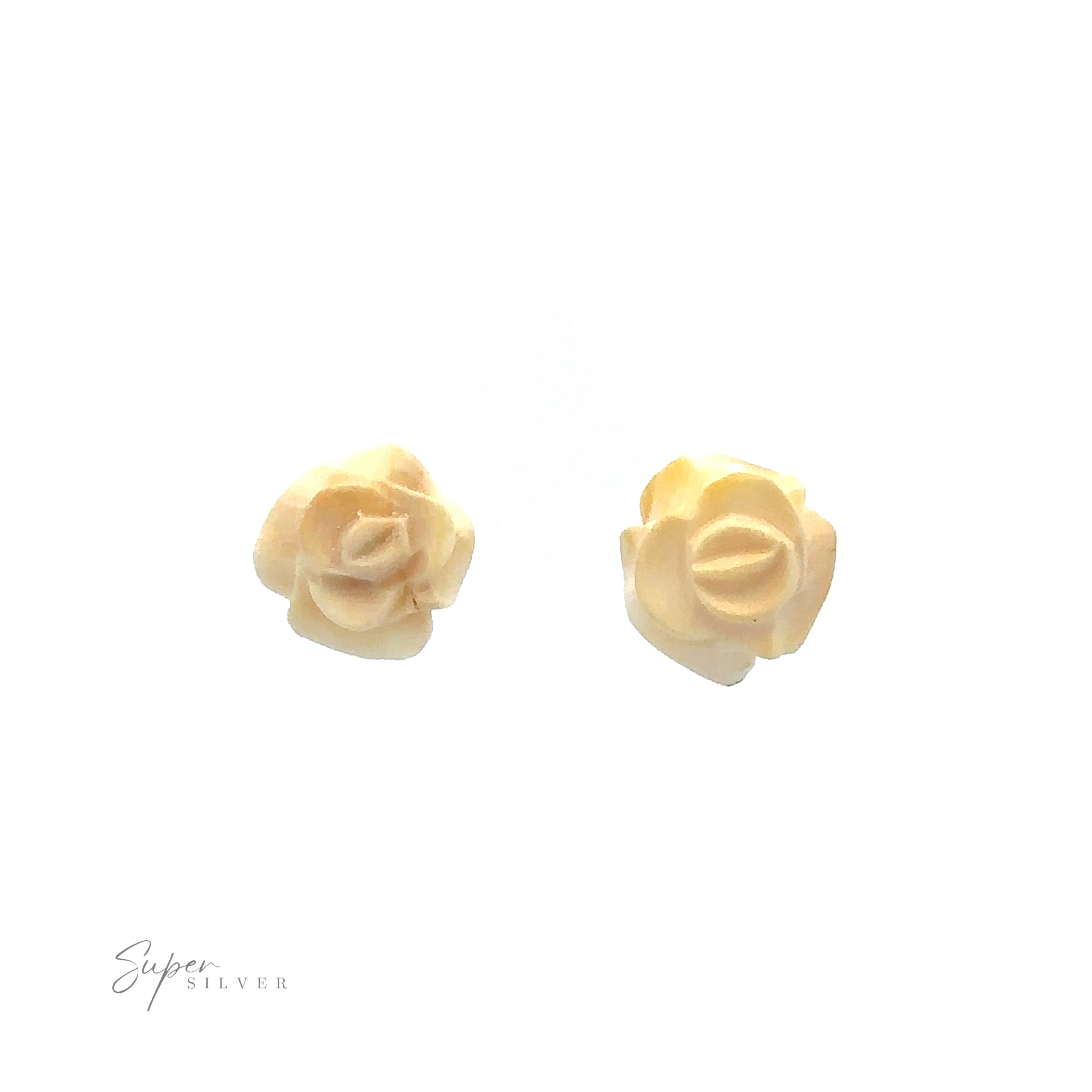 Image of two small, beige rose-shaped earrings on a white background with the text "Super Silver" in the bottom left corner. These elegant pieces are reminiscent of Butterscotch Amber Rose Studs, crafted with sterling silver.
