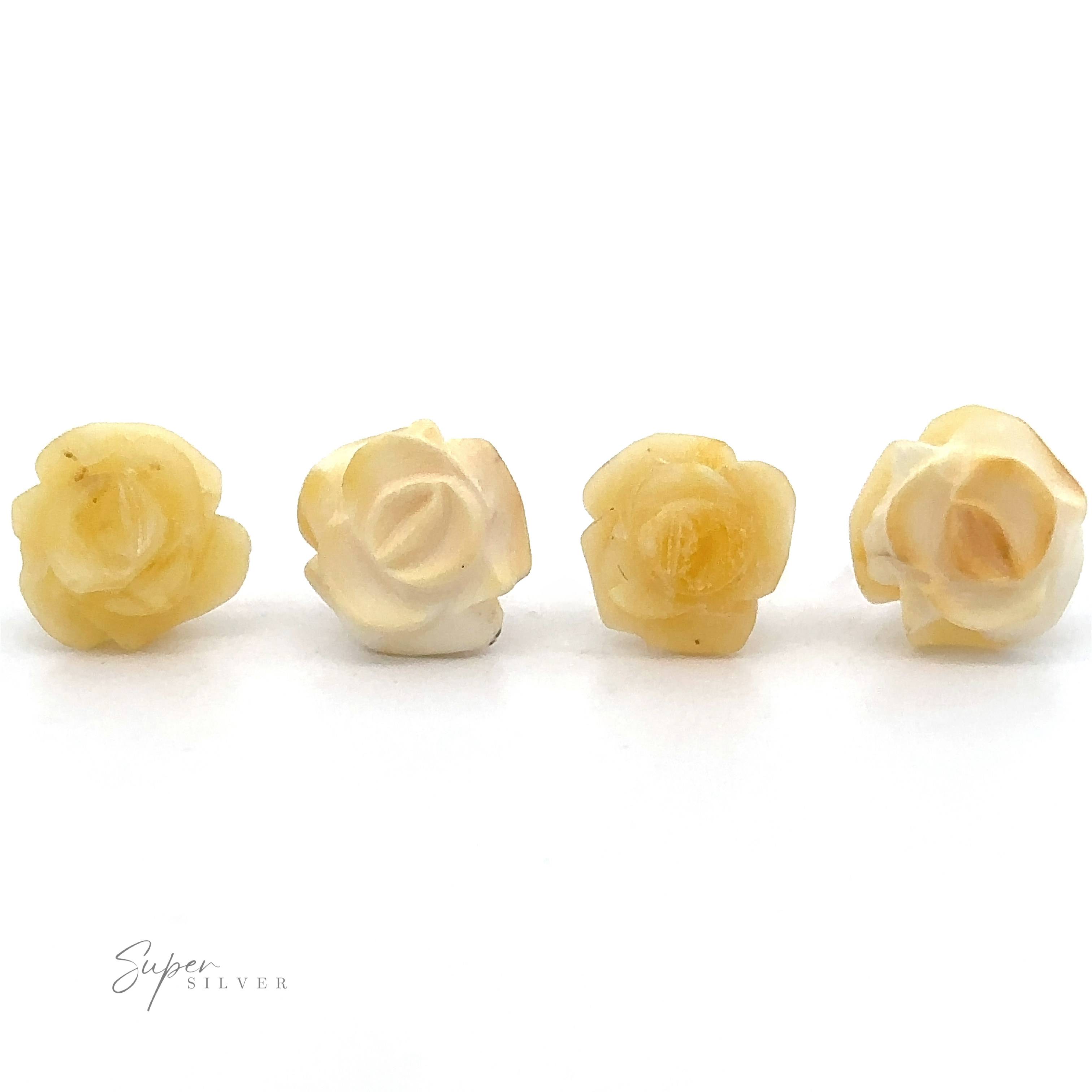 Four small, yellowish-white carved flower beads are arranged in a row on a white background. The image features a logo in the bottom left corner that reads "Super Silver." These delicate Butterscotch Amber Rose Studs bring to mind butterscotch amber jewelry's unique charm.