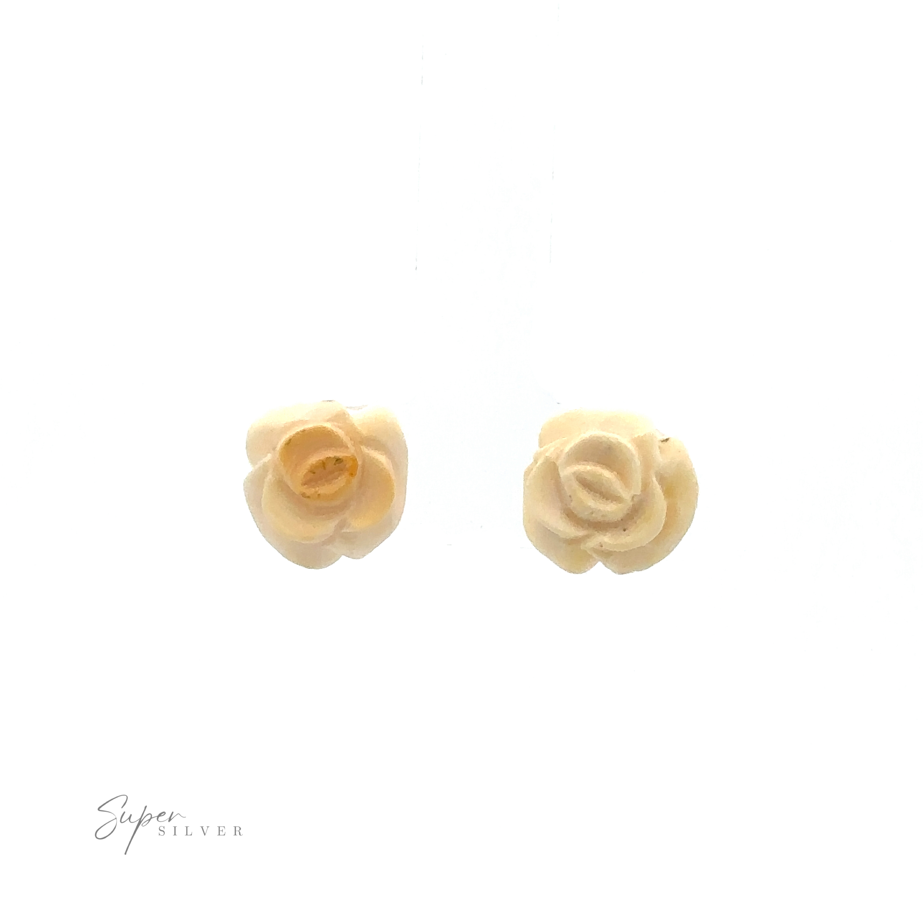 Two small, cream-colored, rose-shaped earrings with "Butterscotch Amber Rose Studs" written in the corner against a plain white background. These elegant sterling silver earrings offer a timeless touch to any outfit.