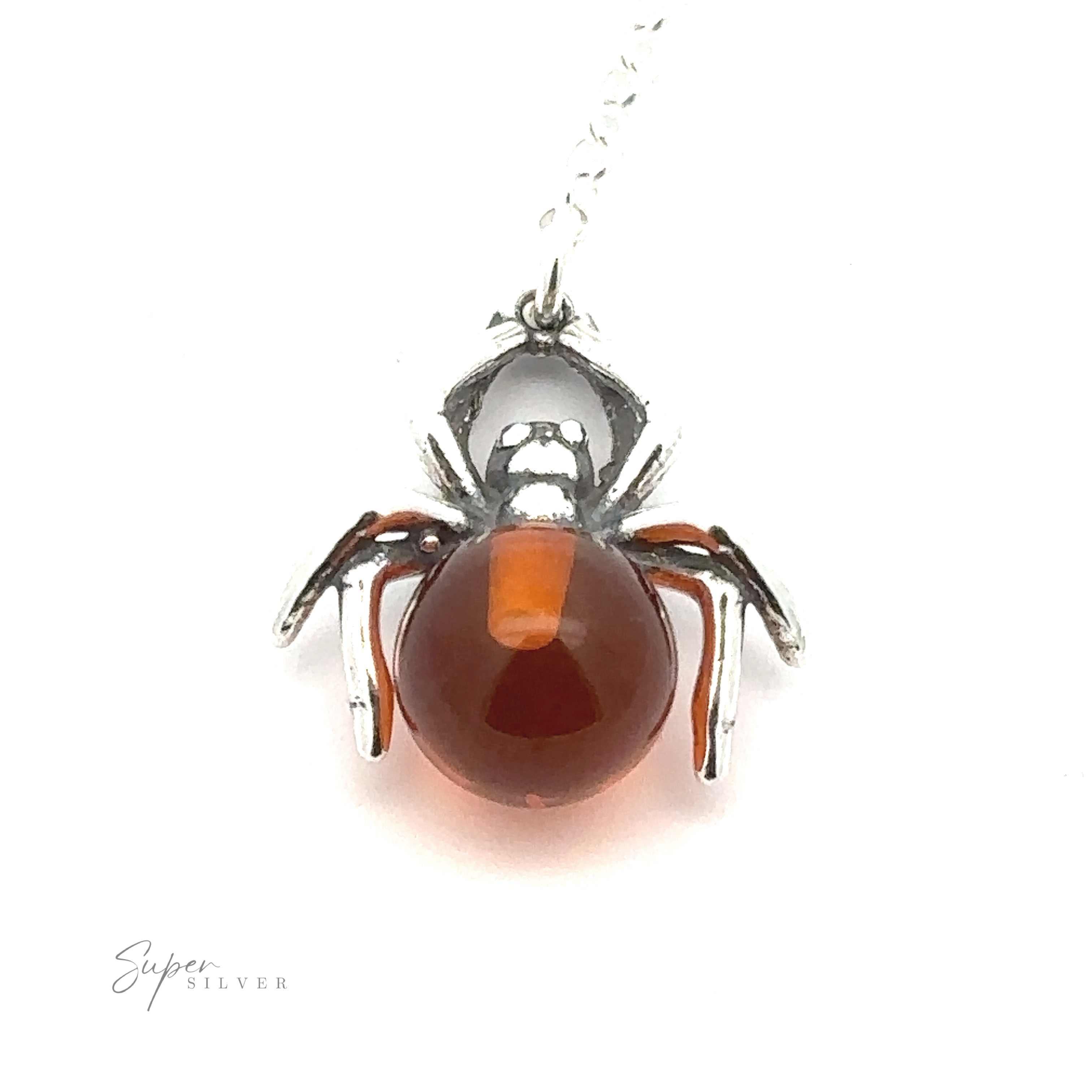 A silver spider-shaped pendant with an amber-colored stone in the body, attached to a chain, exudes a witchy vibe and could easily be your new favorite Baltic Amber Spider Necklace.