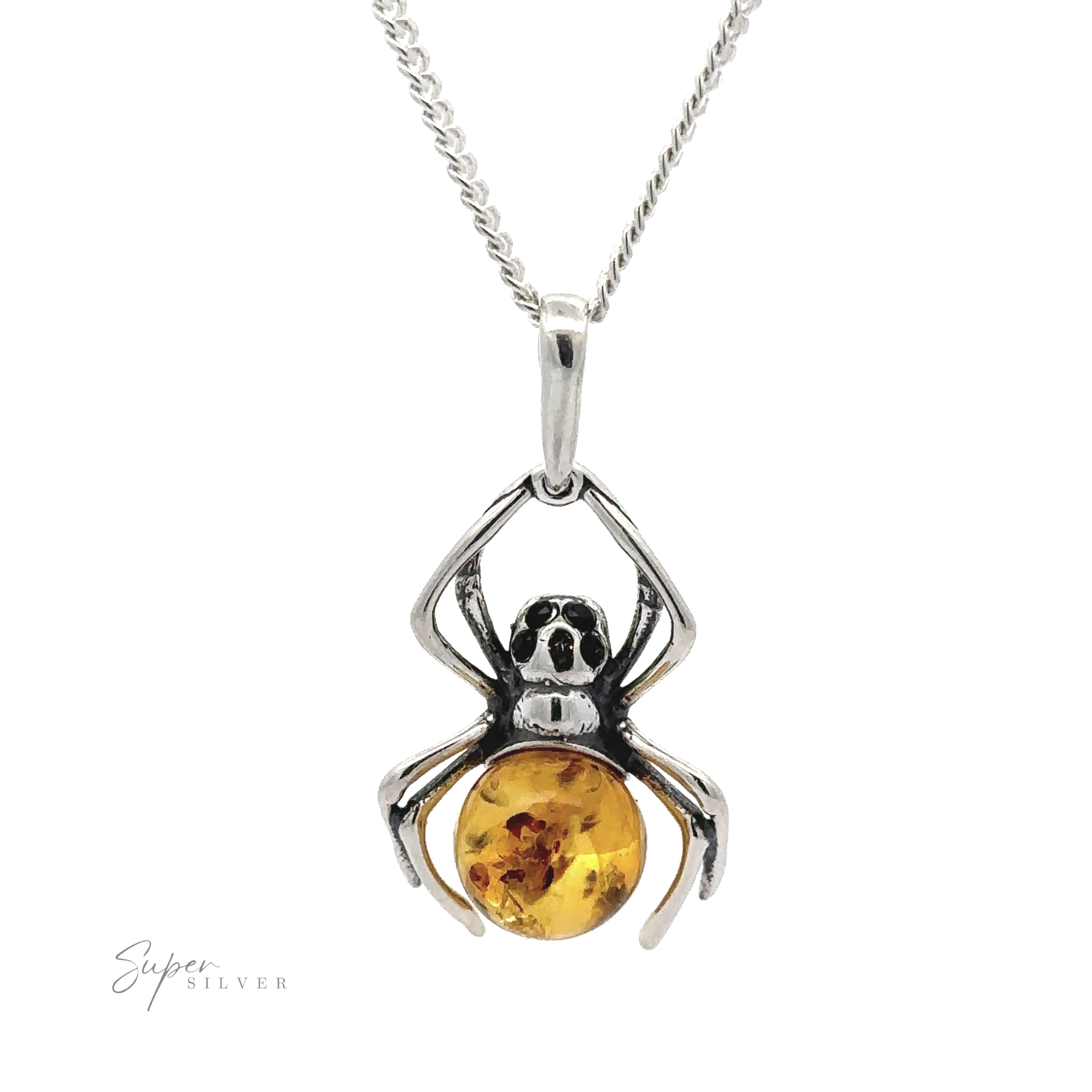 A Baltic Amber Spider Pendant with Onyx Eyes featuring a gothic design of a spider holding an amber gemstone, with onyx eyes adding an extra touch of dark elegance.