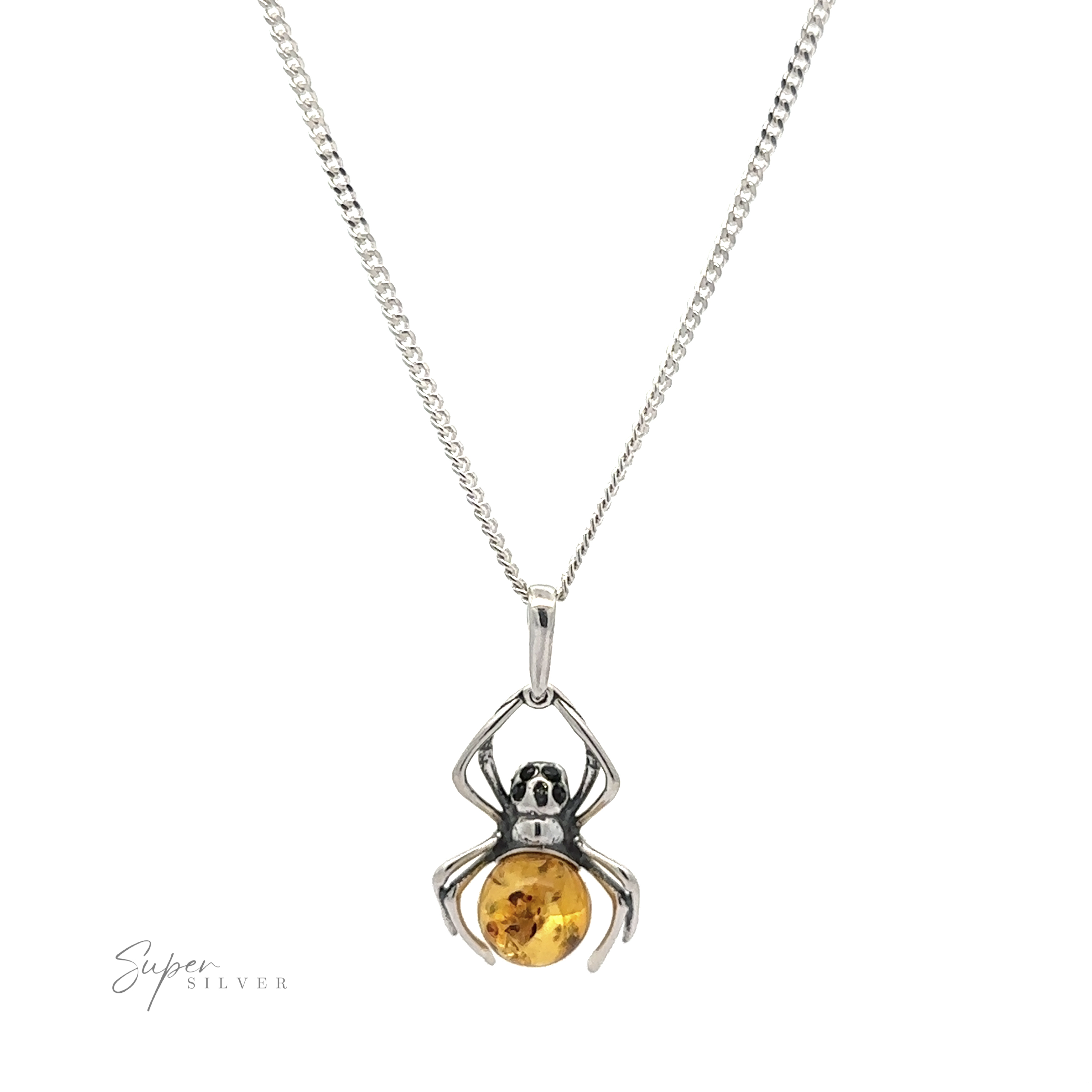 A silver necklace featuring a Baltic Amber Spider Pendant with Onyx Eyes, gripping a round amber stone. The spider's legs encircle the amber, giving it a unique touch of Gothic fashion, while the chain boasts a simple, elegant design.