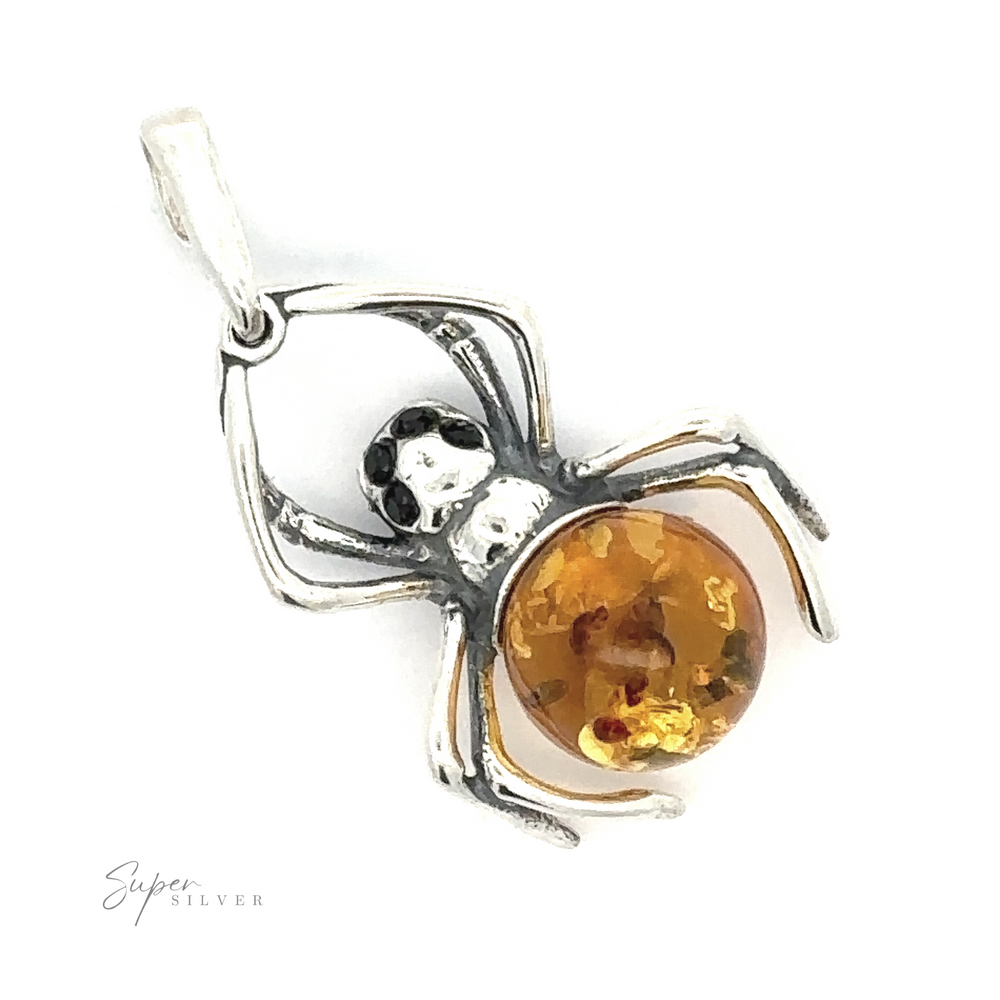 A Baltic Amber Spider Pendant with Onyx Eyes with an amber-colored stone as its body, onyx eyes, and a loop for attaching to a necklace, engraved with "Super Silver." Perfect for those who appreciate Gothic fashion.