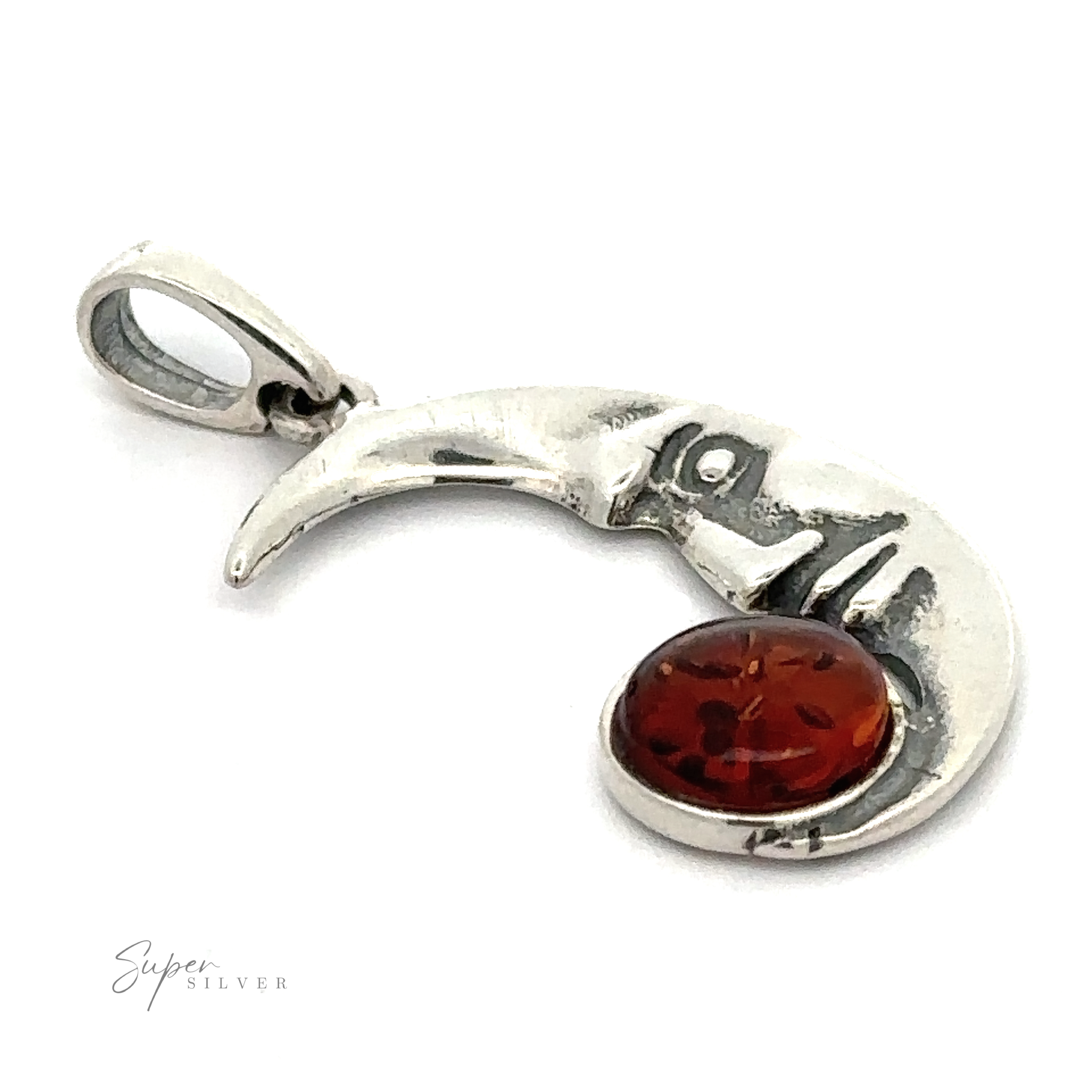 Sterling silver Baltic Amber Man in the Moon Pendant featuring a stunning piece of Baltic amber at its base.