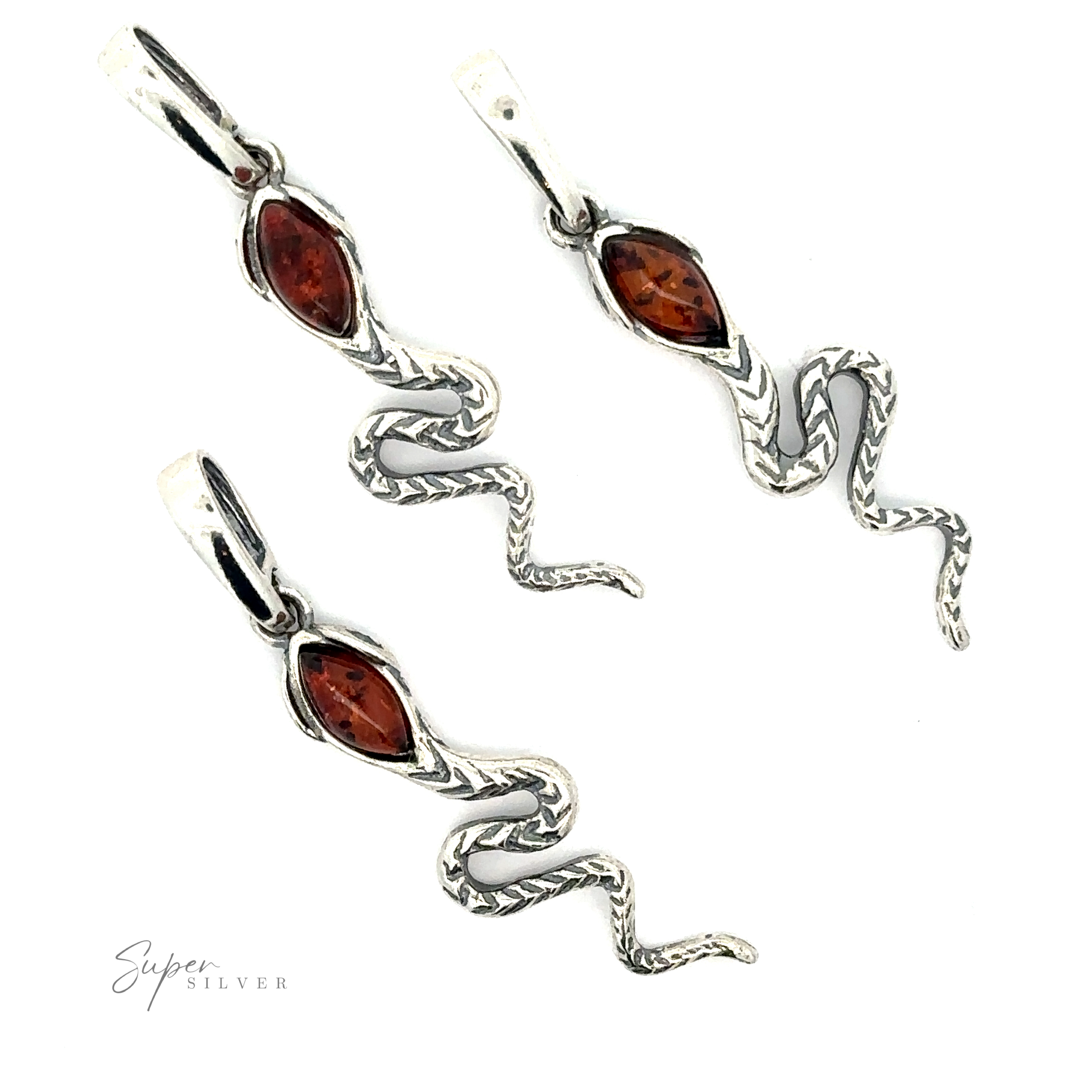A pair of silver snake-shaped earrings with Baltic amber stones embedded in their heads, set against a white background. The earrings boast intricate detailing along the snake's bodies, giving them a vintage vibe that's timeless and elegant.
Alluring Amber Snake Pendant