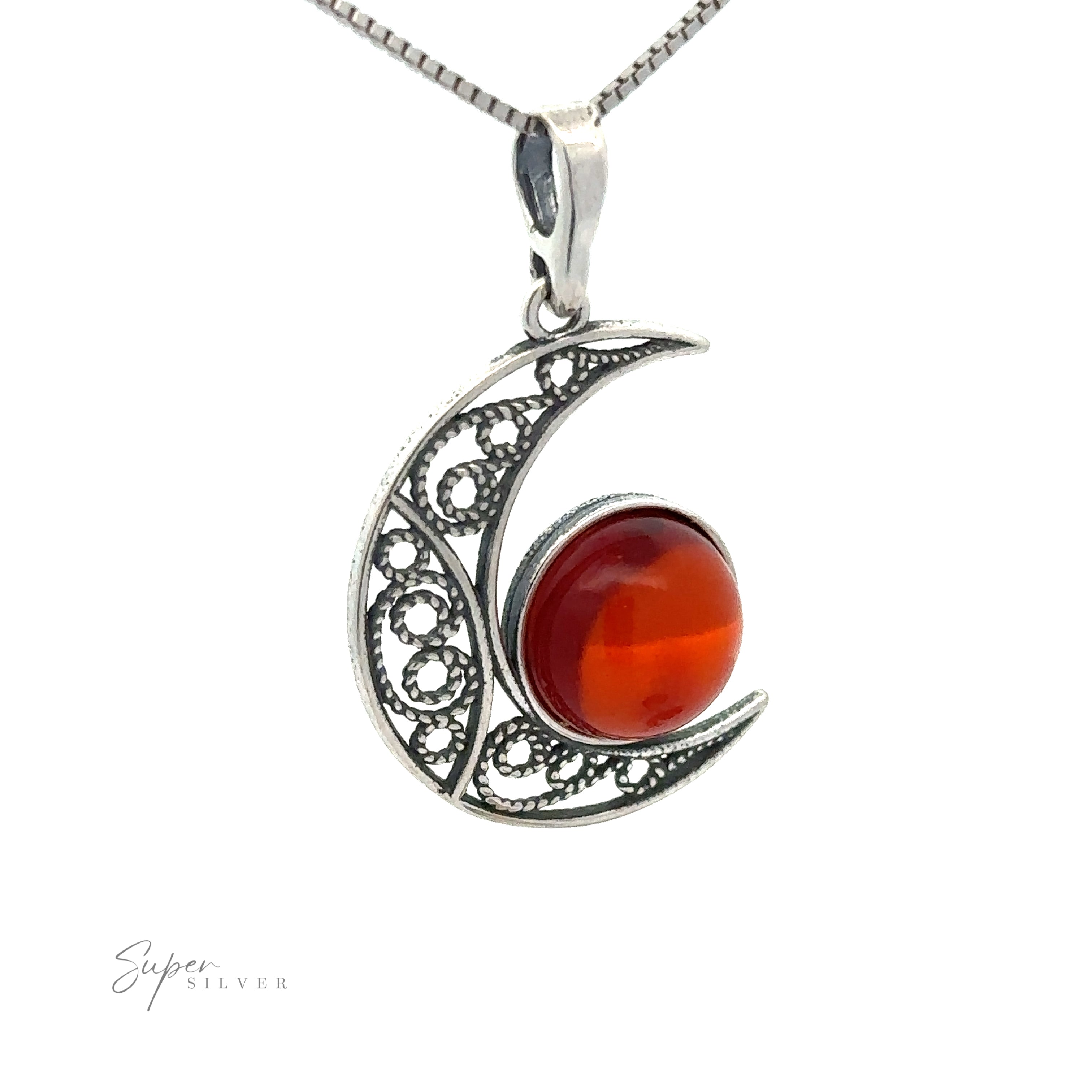 The Baltic Amber Moon Pendant attached to a silver chain.