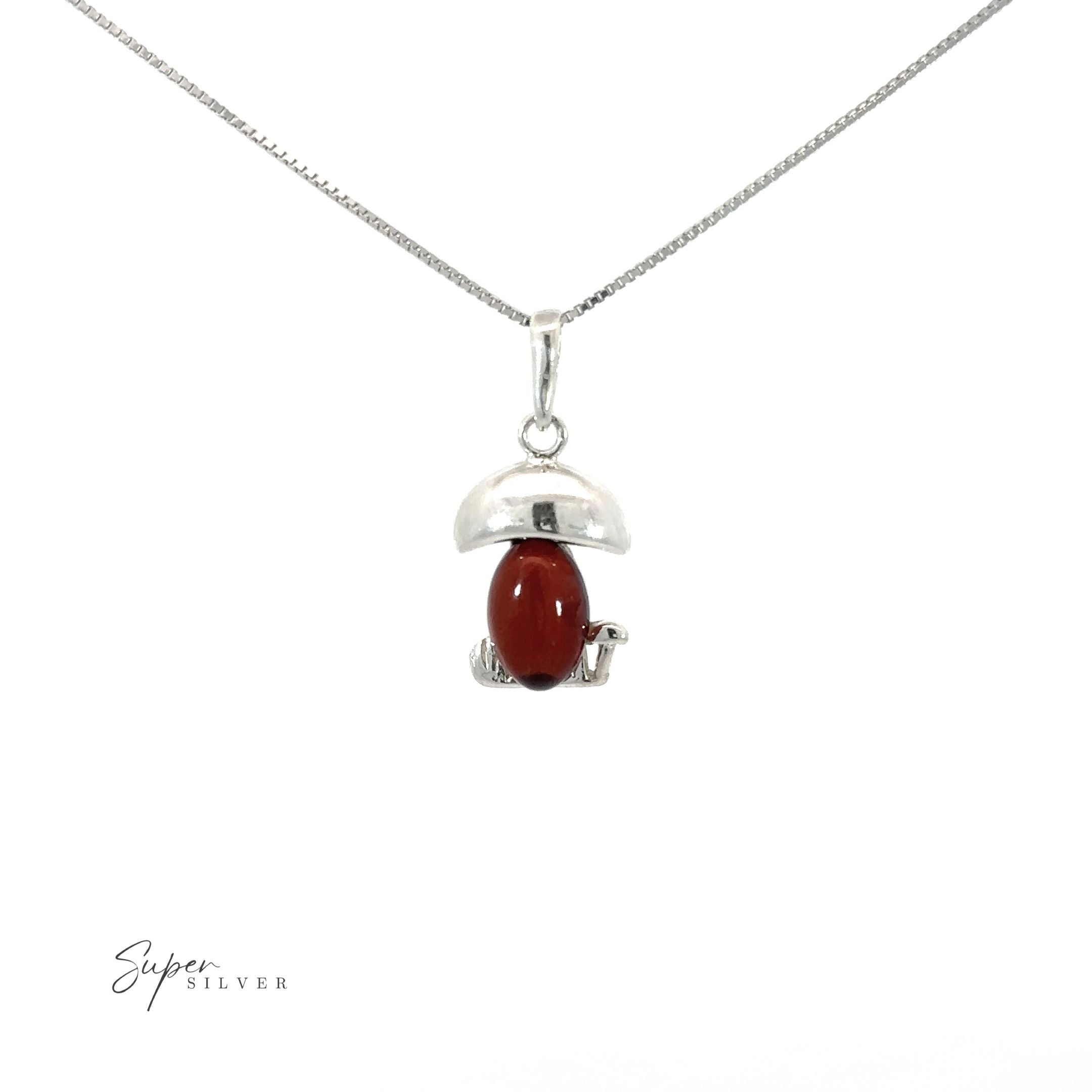 An Amber Mushroom pendant on a silver chain.