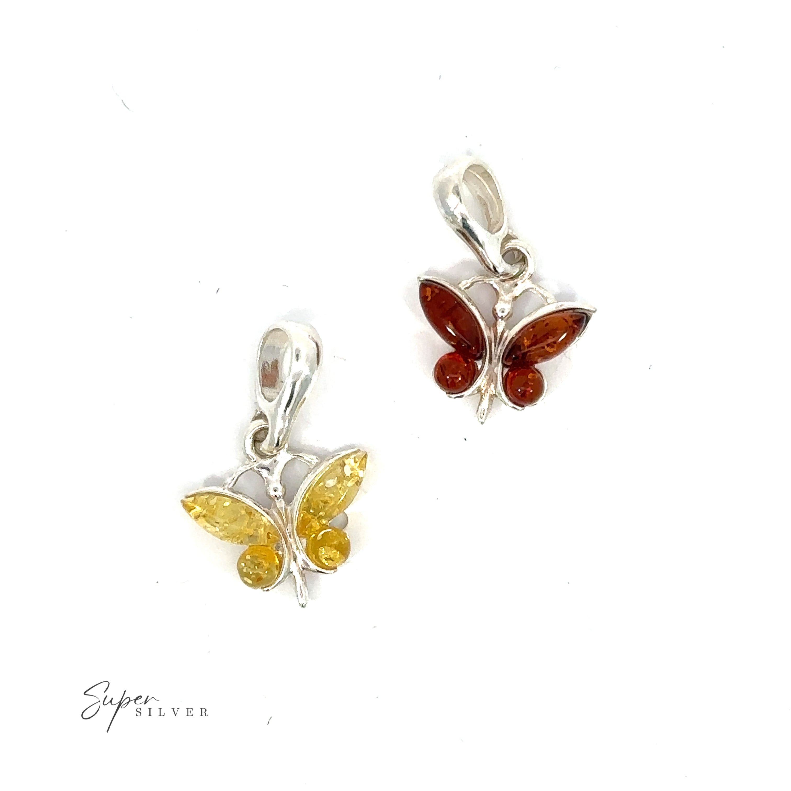 Two silver Small Amber Butterfly Pendants with amber stones.