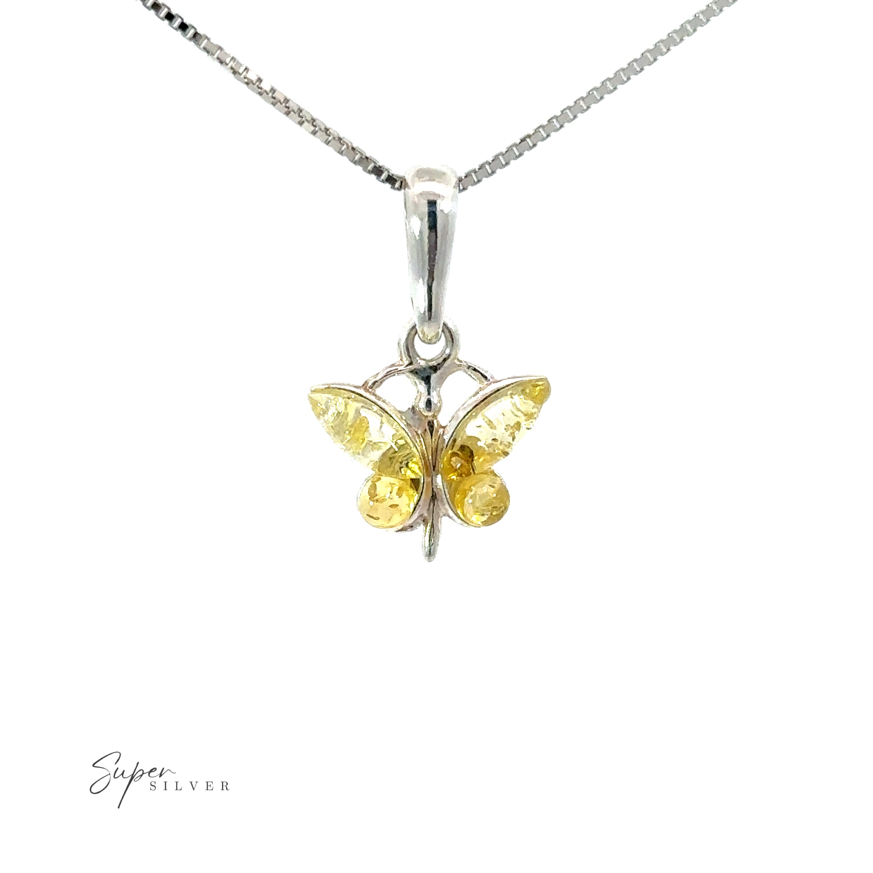 A nature-inspired Small Amber Butterfly Pendant with a yellow sapphire on a silver chain.